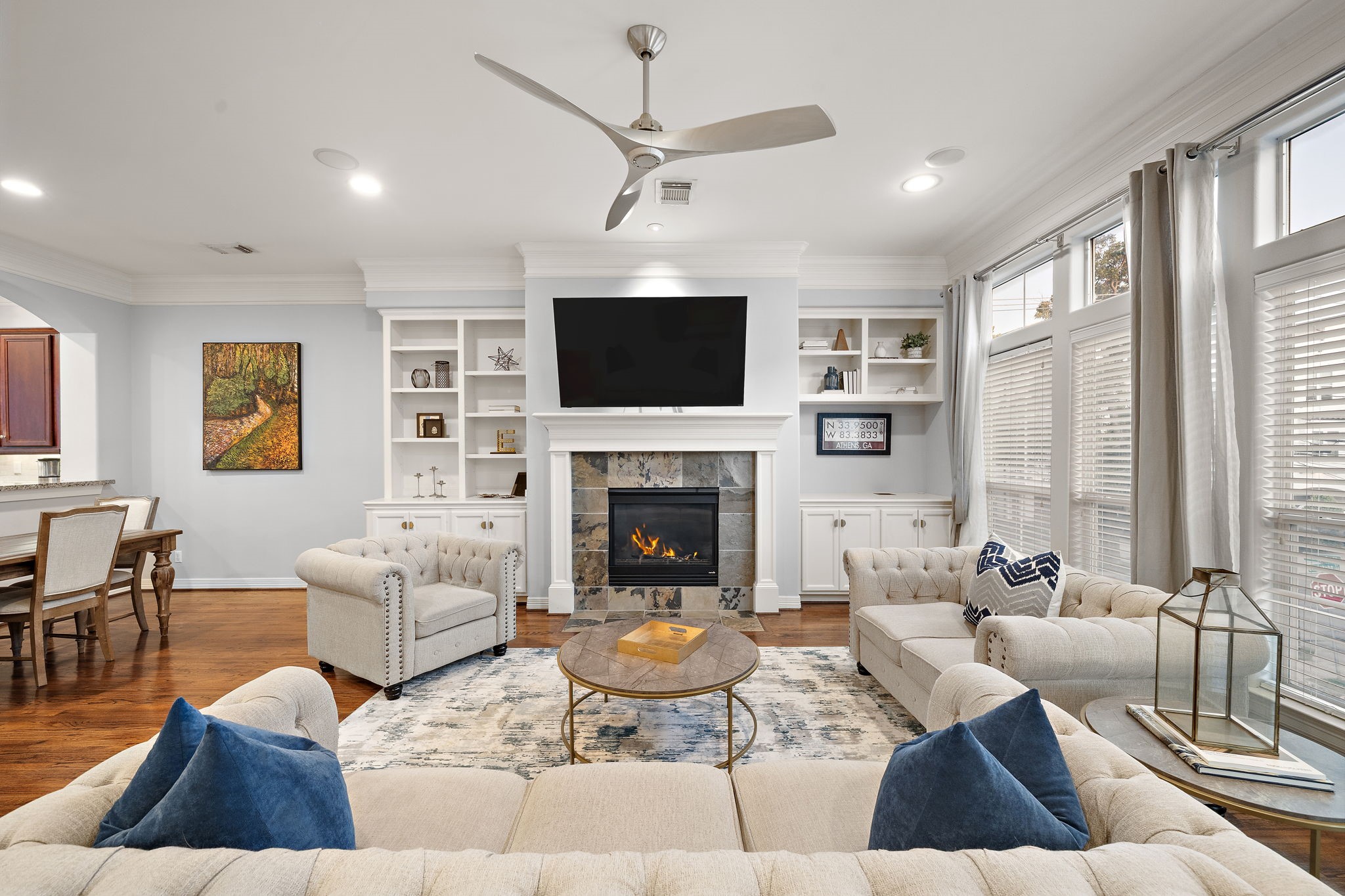 3929 Floyd Street Houston, TX 77007 - Photo 1 of 42 a living room with furniture a flat screen tv and a fireplace