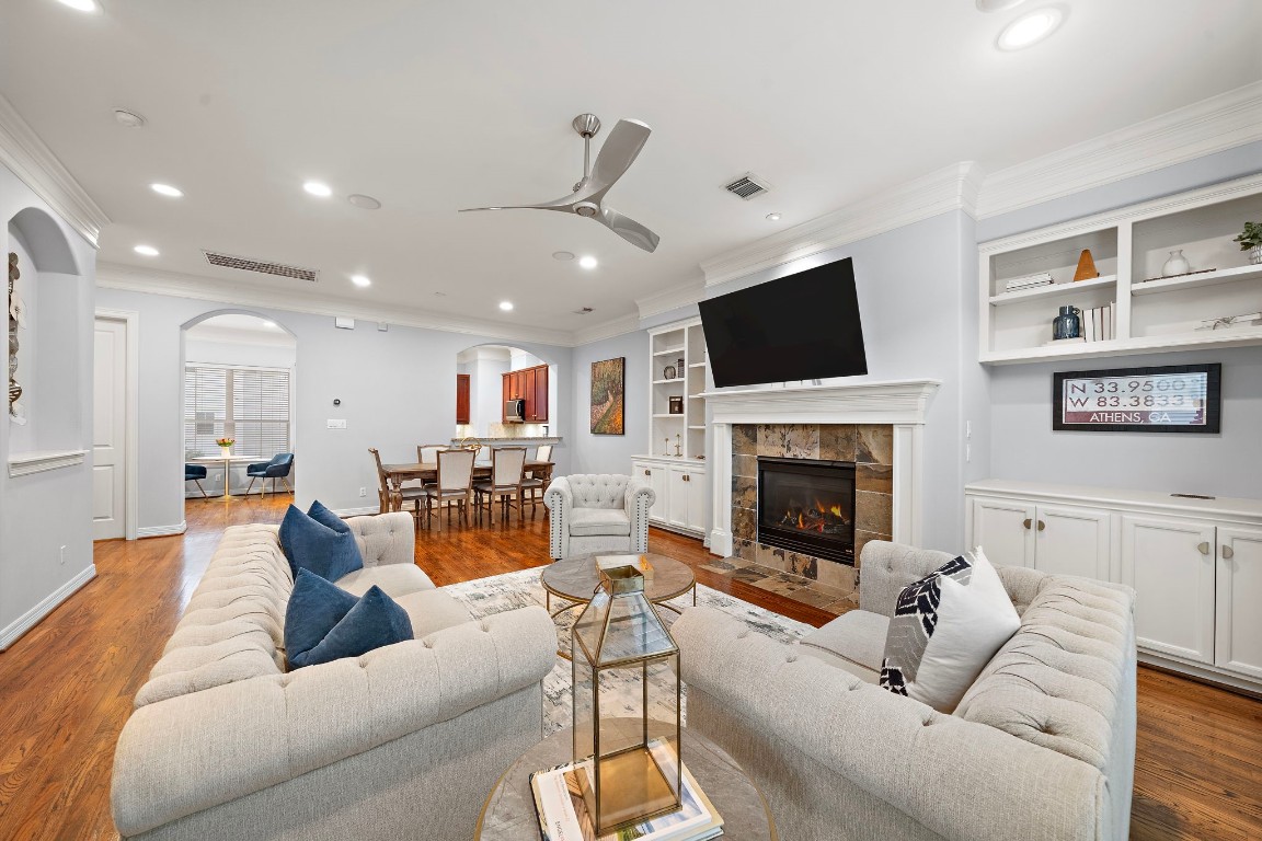 3929 Floyd Street Houston, TX 77007 - Photo 14 of 42 a living room with furniture a fireplace and a flat screen tv