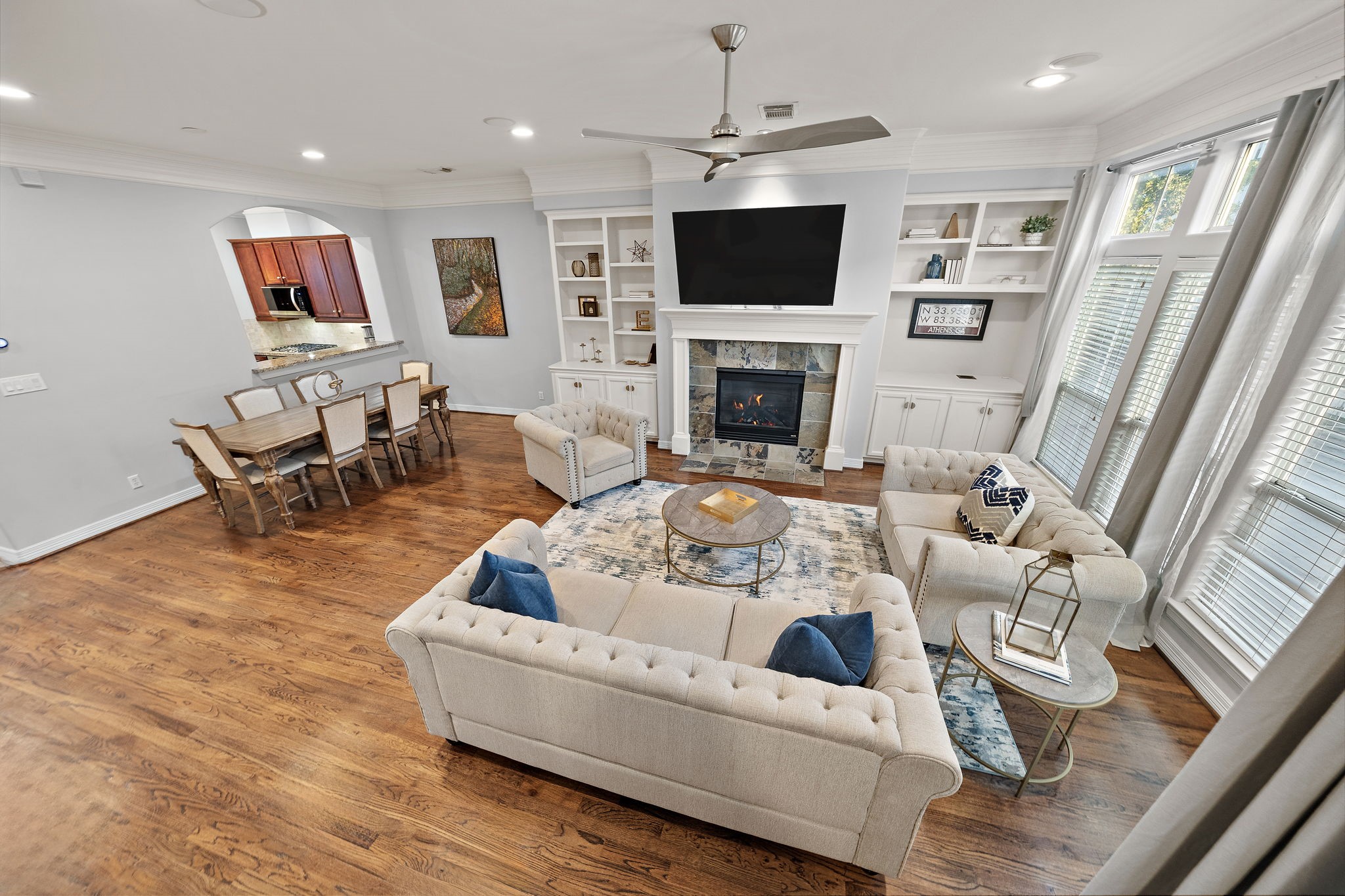 3929 Floyd Street Houston, TX 77007 - Photo 21 of 42 a living room with furniture a fireplace and a flat screen tv