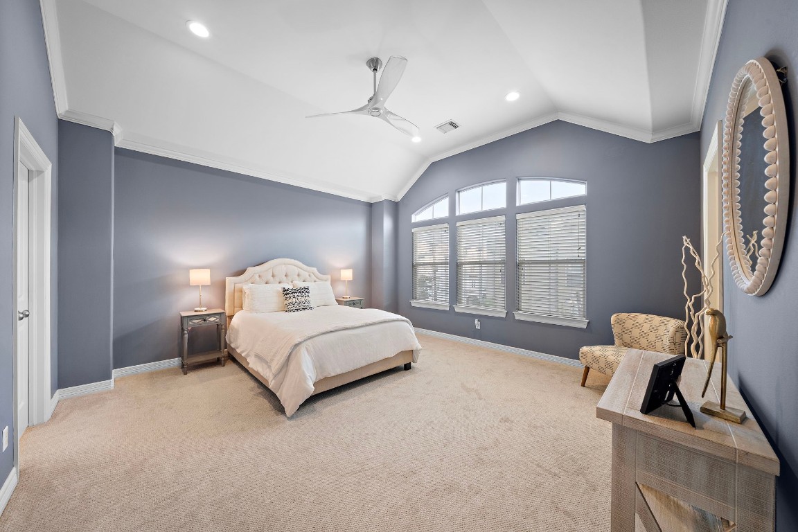 3929 Floyd Street Houston, TX 77007 - Photo 22 of 42 a spacious bedroom with a bed and a large window