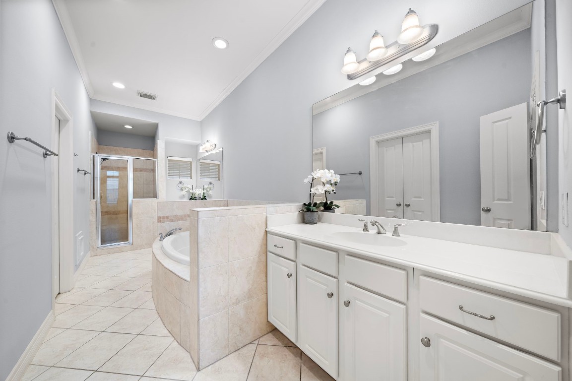3929 Floyd Street Houston, TX 77007 - Photo 25 of 42 a large white bathroom with a sink a mirror and a shower