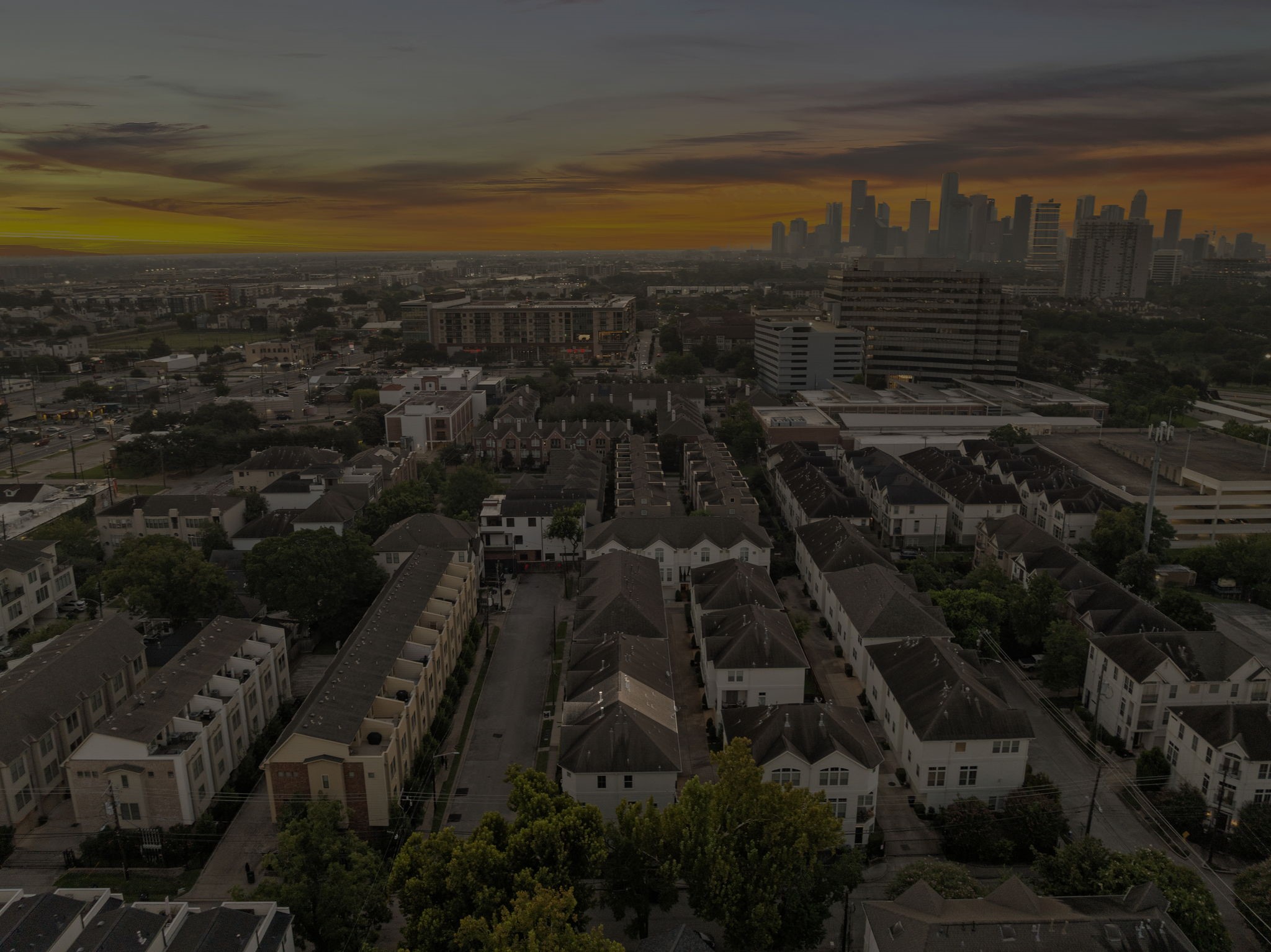 3929 Floyd Street Houston, TX 77007 - Photo 37 of 42 Panoramic aerial reveals 3929 Floyd St nestled amid tree-lined townhome enclaves and vibrant city surroundings, with Downtown Houston’s striking skyline nearby.