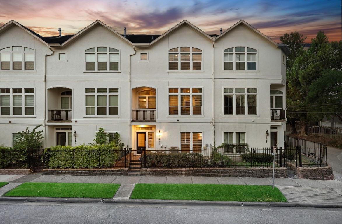 3929 Floyd Street Houston, TX 77007 - Photo 4 of 42 3929 Floyd St offers timeless stucco appeal across three stories, highlighting a low-maintenance lot and gated entry. Enjoy the convenience of a 2-car garage and security gate, all within quick reach of Downtown, the Galleria, Memorial Park, and premier restaurants and shopping destinations.