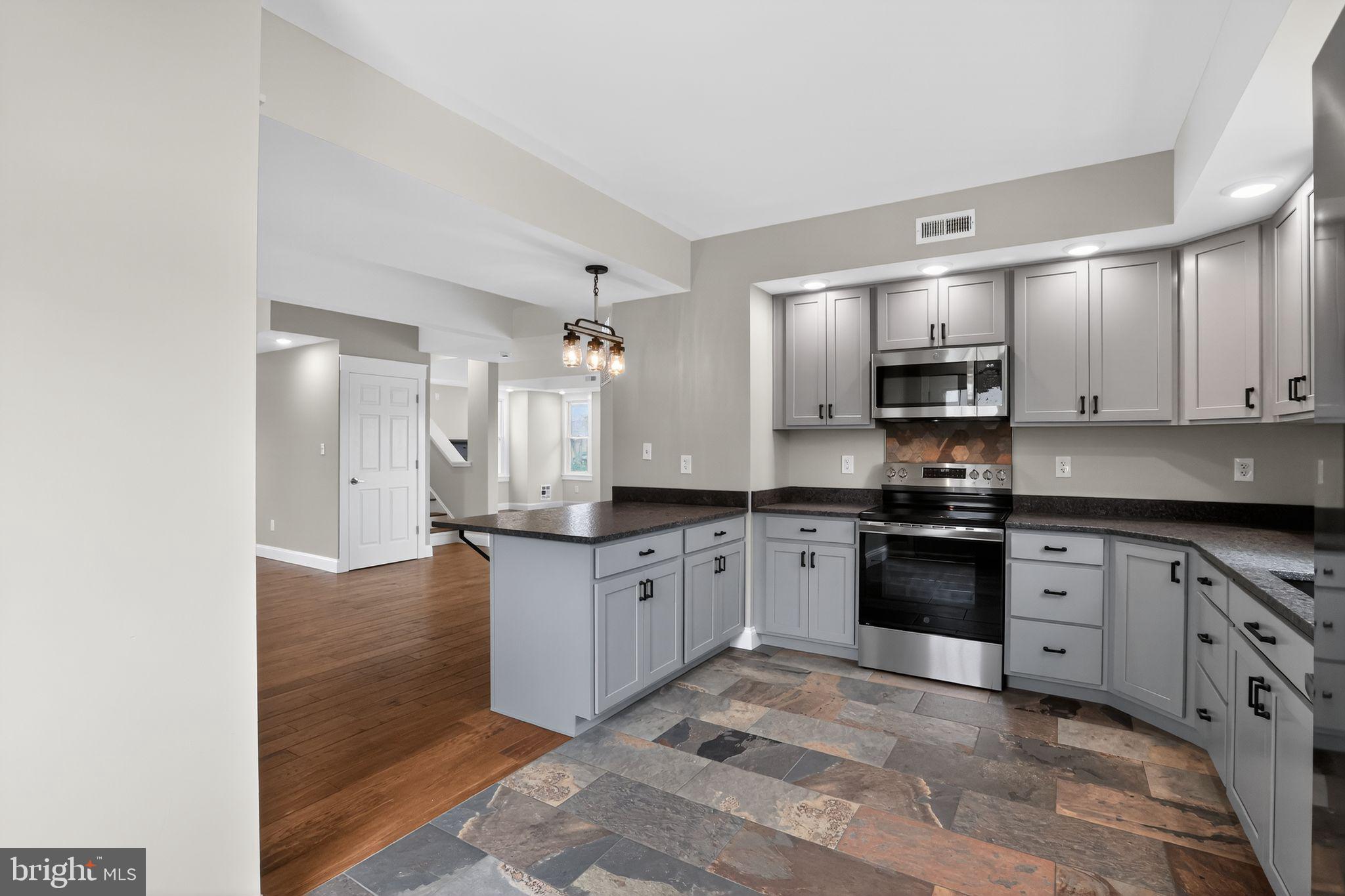 128 Maugers Mill Road Pottstown, PA 19464 - Photo 14 of 42 Modern kitchen with sleek finishes.