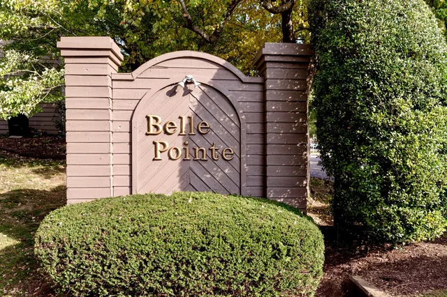 a view of an empty room with window and fire place