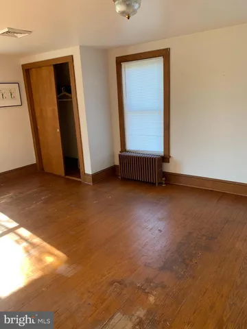 a bathroom with a tub a sink and a window