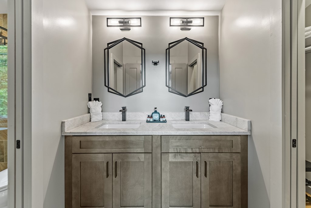 880 Little Bushy Head Road Blue Ridge, GA 30513 - Photo 27 of 51 a bathroom with double vanity sinks and two mirror