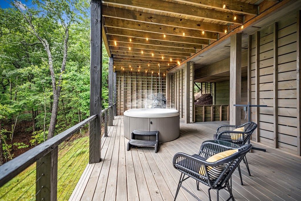 880 Little Bushy Head Road Blue Ridge, GA 30513 - Photo 45 of 51 a view of a balcony with chair and wooden floor