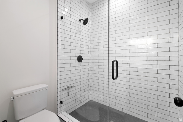 1952 South Comanche Circle Farmington, UT 84025 - Photo 33 of 52 Bathroom with a stall shower and toilet