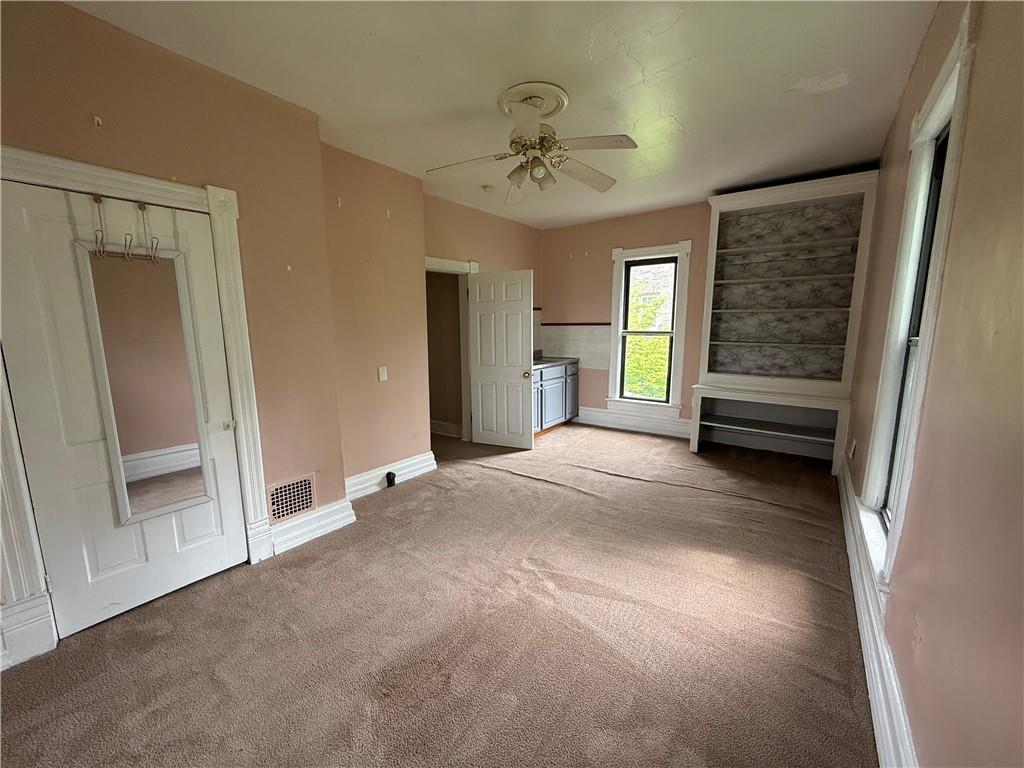 216 Center Street Slippery Rock, PA 16057 - Photo 20 of 34 The largest bedroom is on the upper level and includes built in shelving, a sink and large closet.