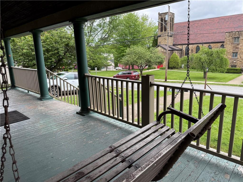 216 Center Street Slippery Rock, PA 16057 - Photo 3 of 34 Enchanting wooden swing to enjoy quiet moments on the covered front porch!