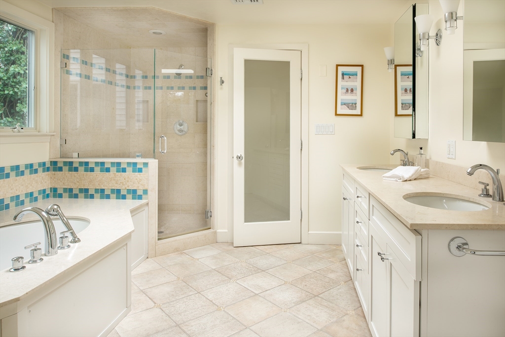 56 Varick Road Newton, MA 02468 - Photo 12 of 21 a bathroom with a sink vanity tub and shower