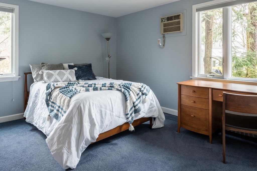 56 Varick Road Newton, MA 02468 - Photo 15 of 21 a bed sitting in a bedroom next to a window