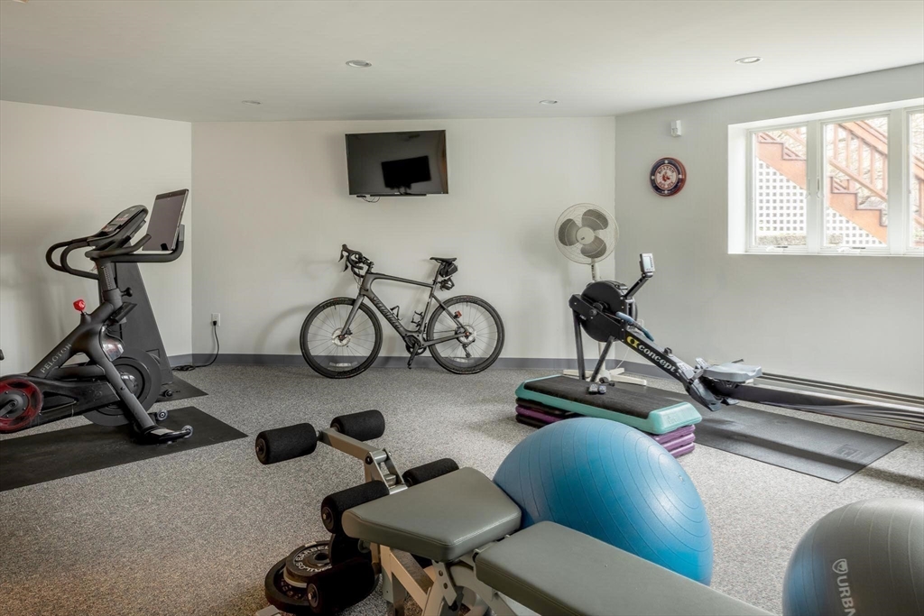 56 Varick Road Newton, MA 02468 - Photo 18 of 21 a view of a room with gym equipment