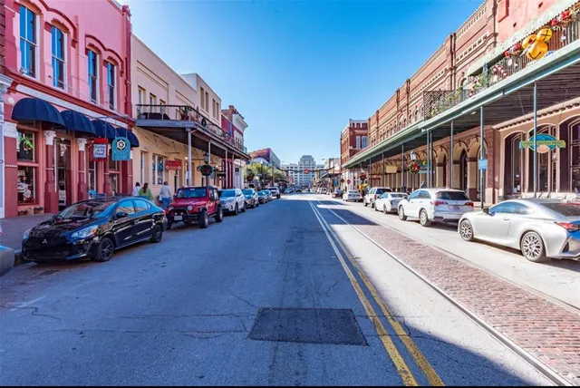a view of a street with cars