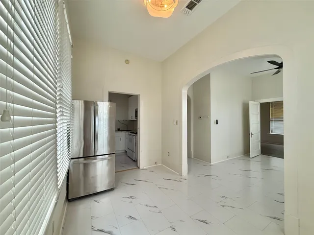 a view of hallway with cabinets