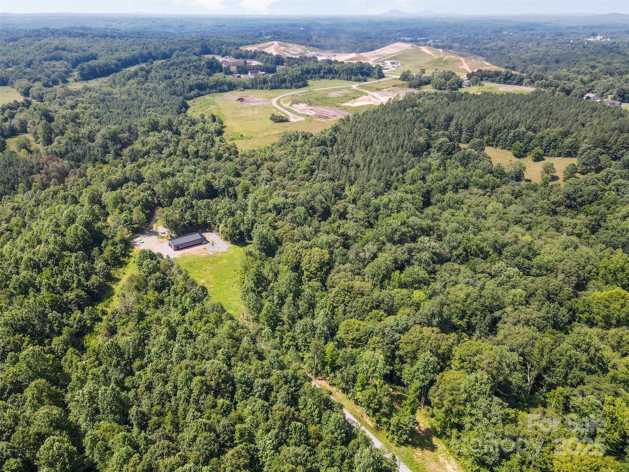 1371 Alexis High Shoals Road Dallas, NC 28034 - Photo 15 of 19 an aerial view of residential houses with outdoor space and trees