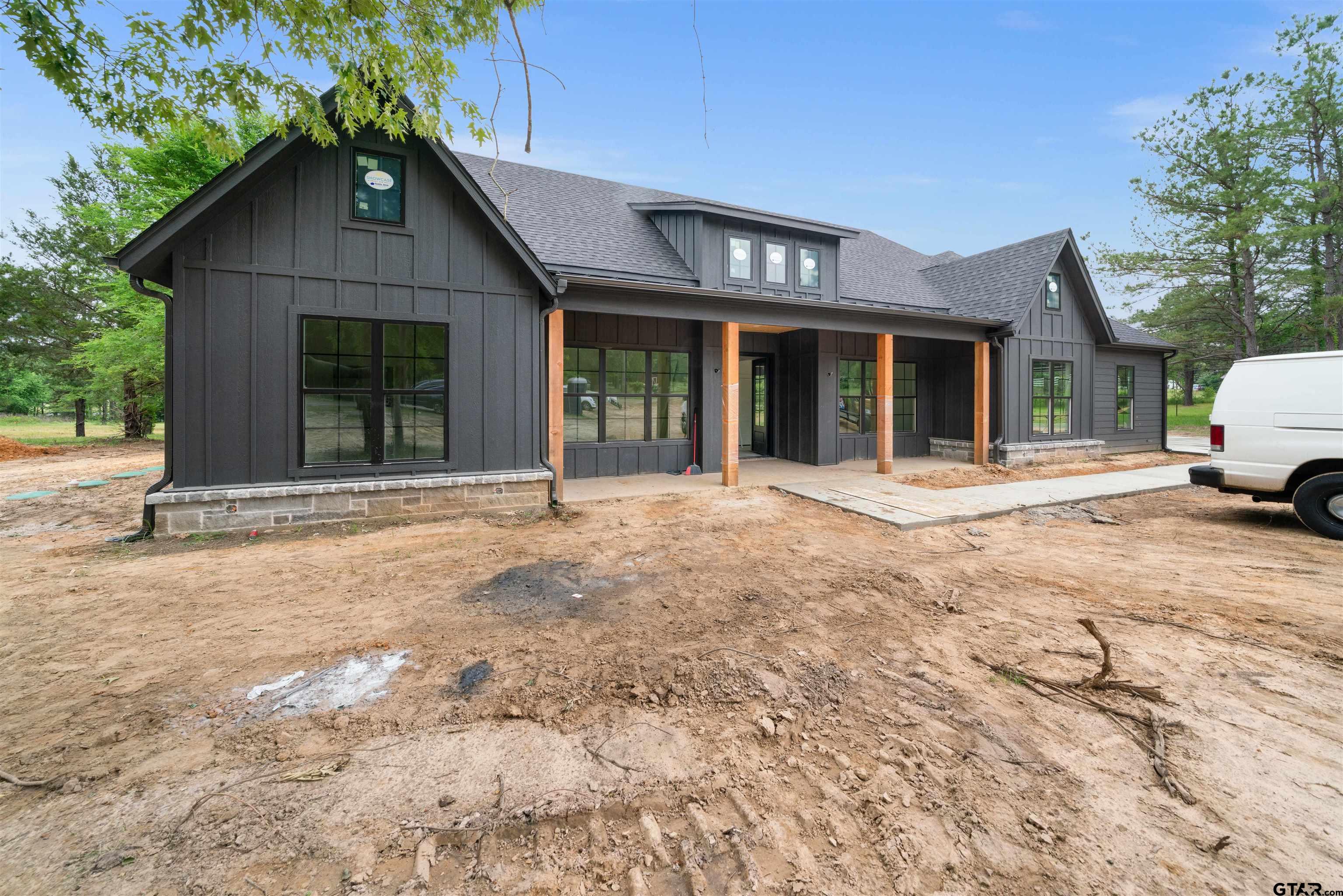 a front view of a house with a outdoor space