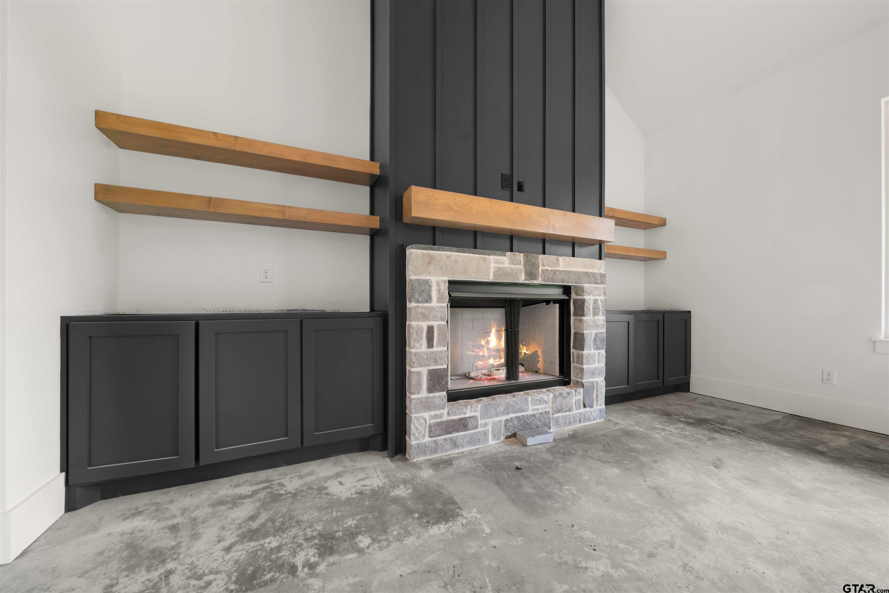 15050 7 League Road Tyler, TX 75703 - Photo 16 of 35 a view of an empty room with a fireplace