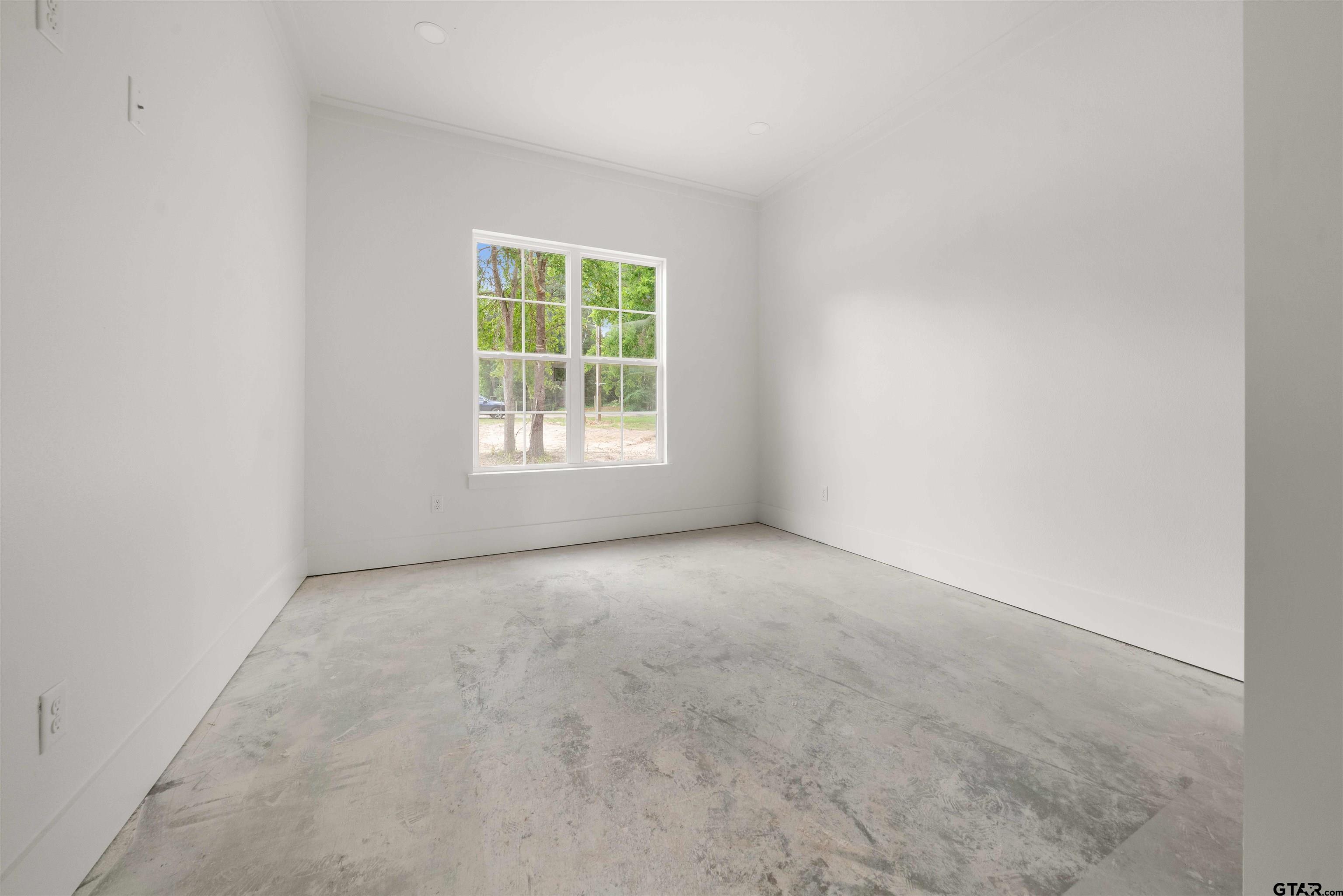 15050 7 League Road Tyler, TX 75703 - Photo 17 of 35 an empty room with a window