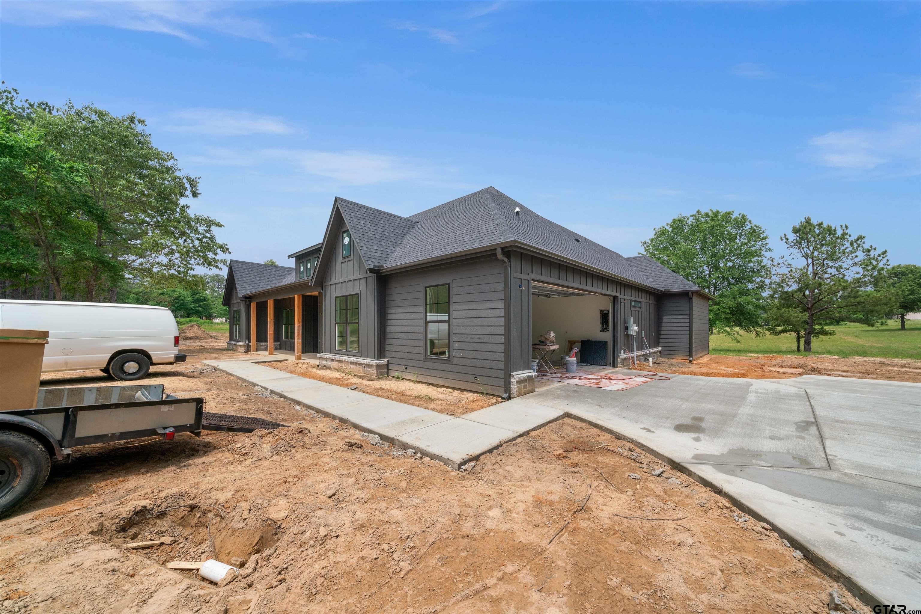 15050 7 League Road Tyler, TX 75703 - Photo 2 of 35 a view of a house with backyard and sitting area