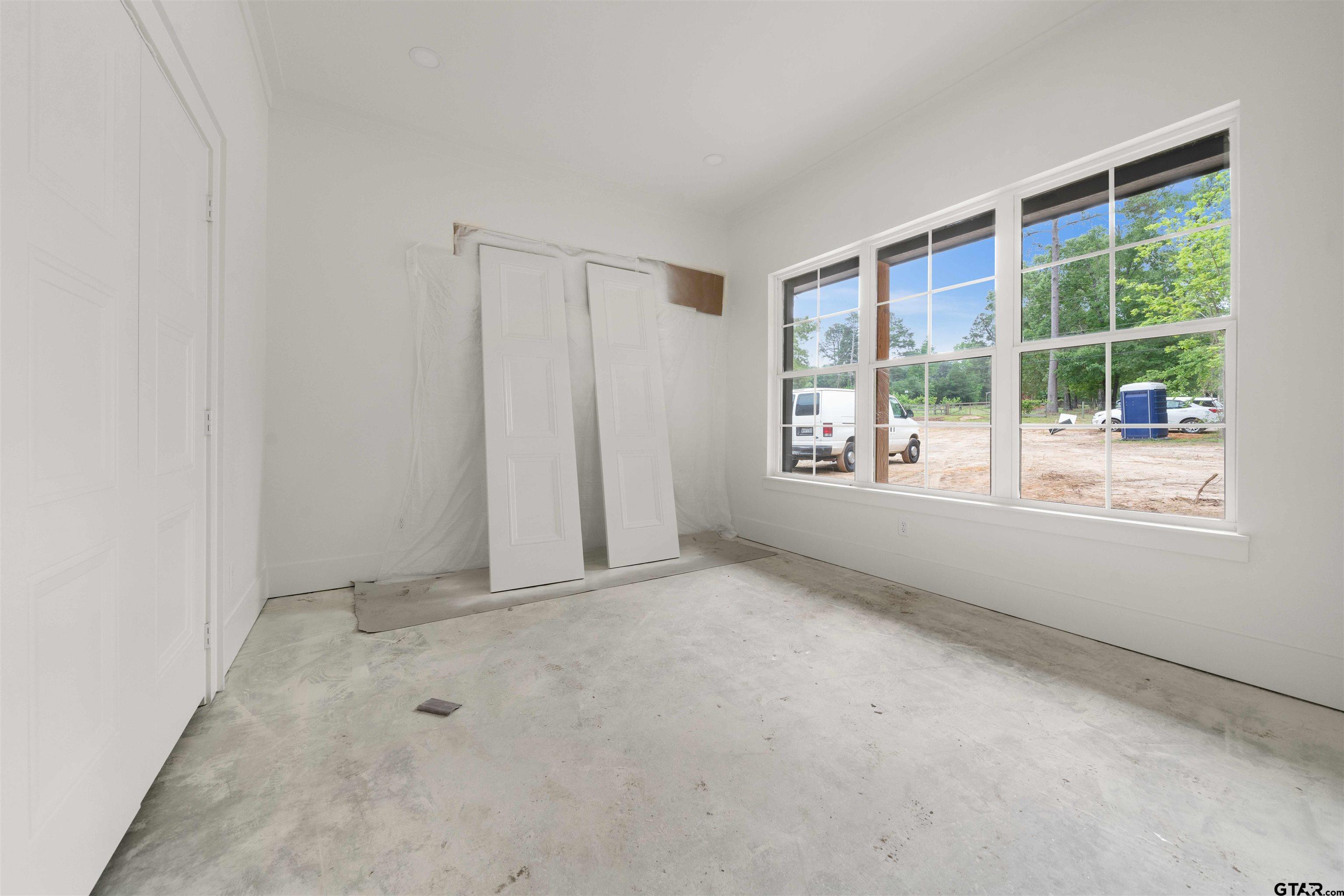 15050 7 League Road Tyler, TX 75703 - Photo 32 of 35 an empty room with windows