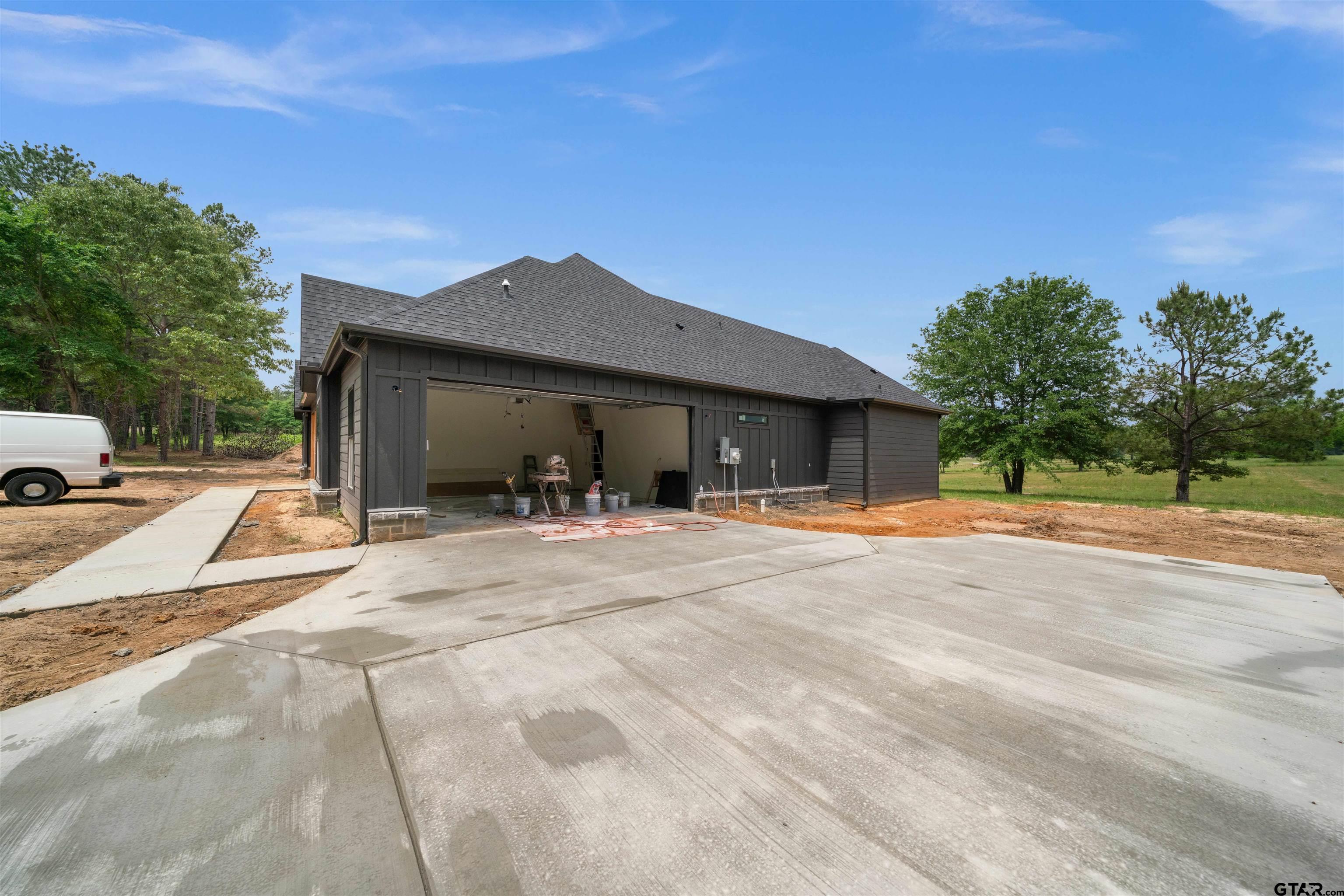 15050 7 League Road Tyler, TX 75703 - Photo 33 of 35 a view of a house with backyard and a tree