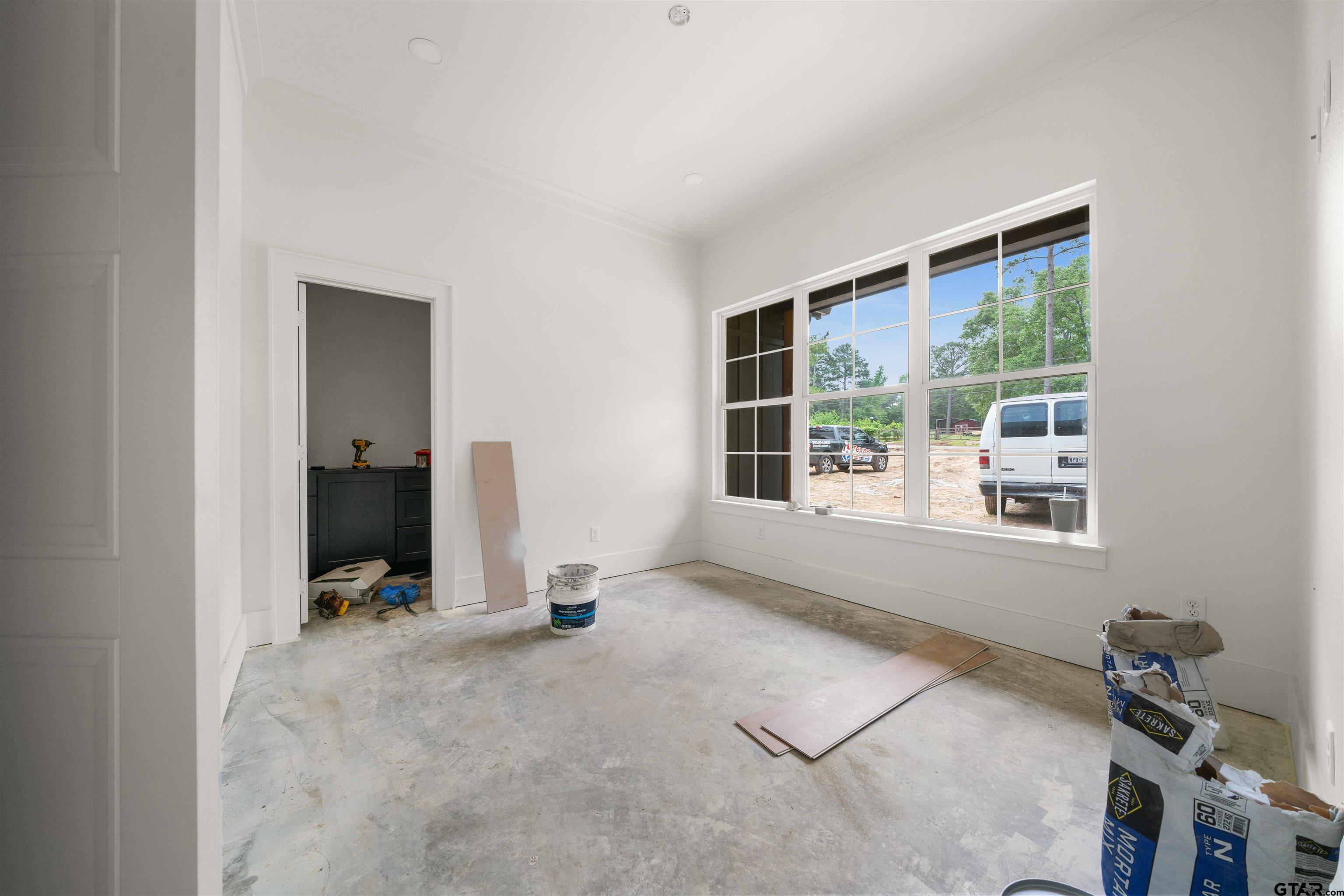 15050 7 League Road Tyler, TX 75703 - Photo 5 of 35 a view of an empty room with a window