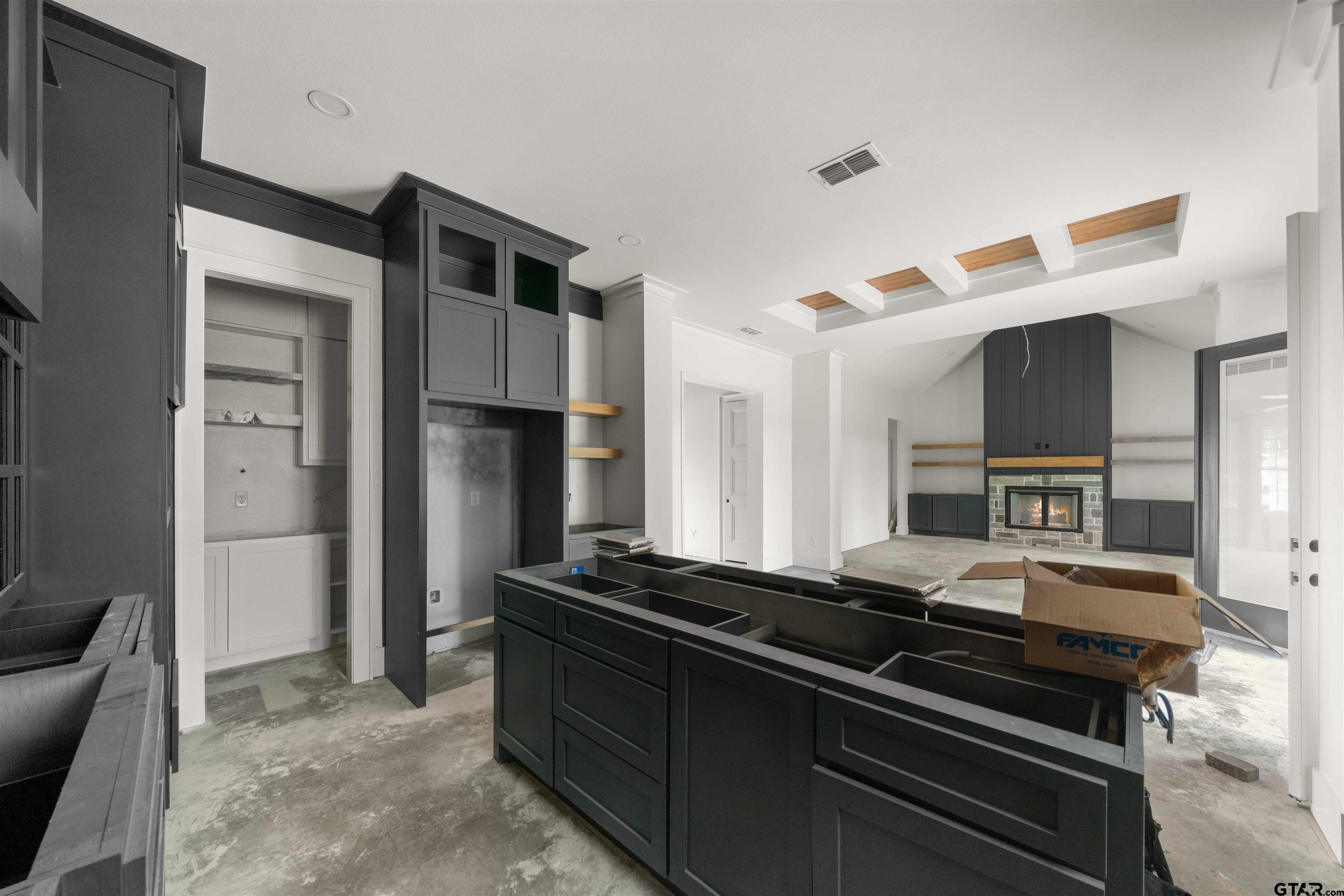 15050 7 League Road Tyler, TX 75703 - Photo 9 of 35 a kitchen with a refrigerator and a sink