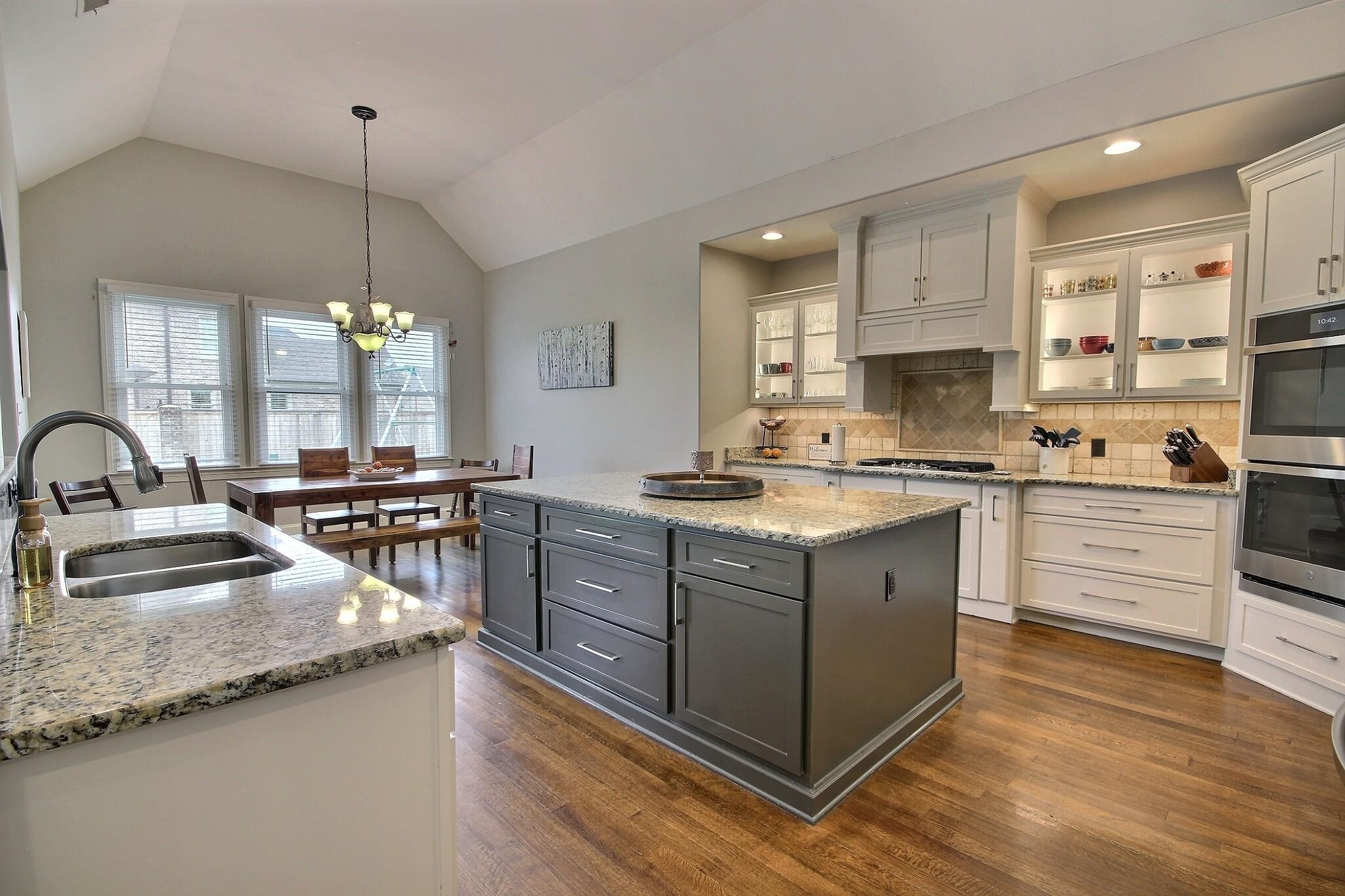 1707 Totty Lane Collierville, TN 38017 - Photo 13 of 40 a kitchen with stainless steel appliances granite countertop a sink stove and cabinets