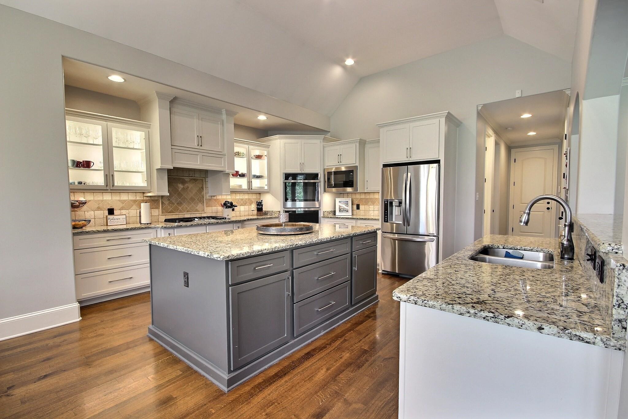 1707 Totty Lane Collierville, TN 38017 - Photo 14 of 40 a kitchen with a refrigerator sink and cabinets
