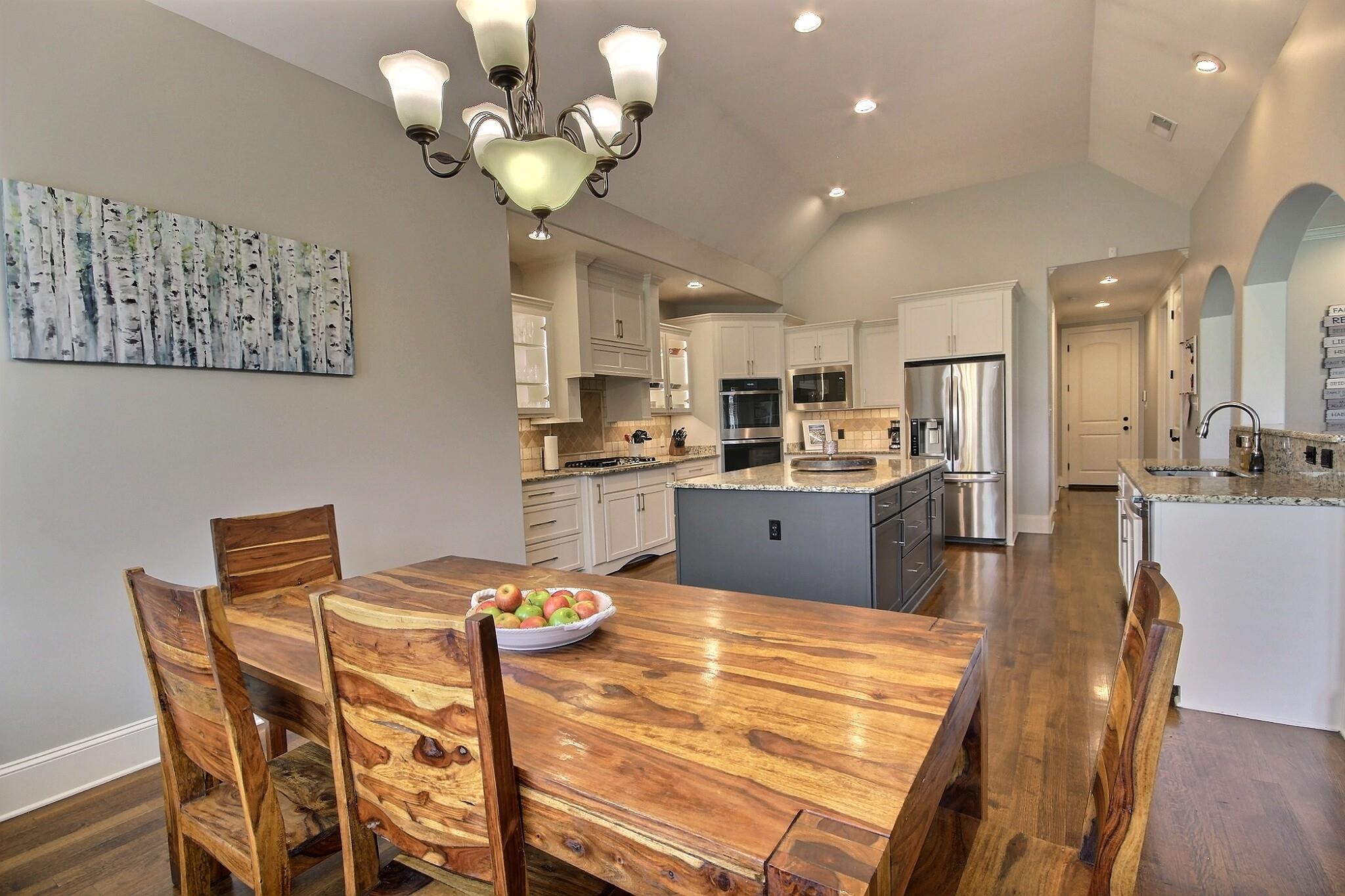 1707 Totty Lane Collierville, TN 38017 - Photo 15 of 40 a view of a dining room with furniture and wooden floor