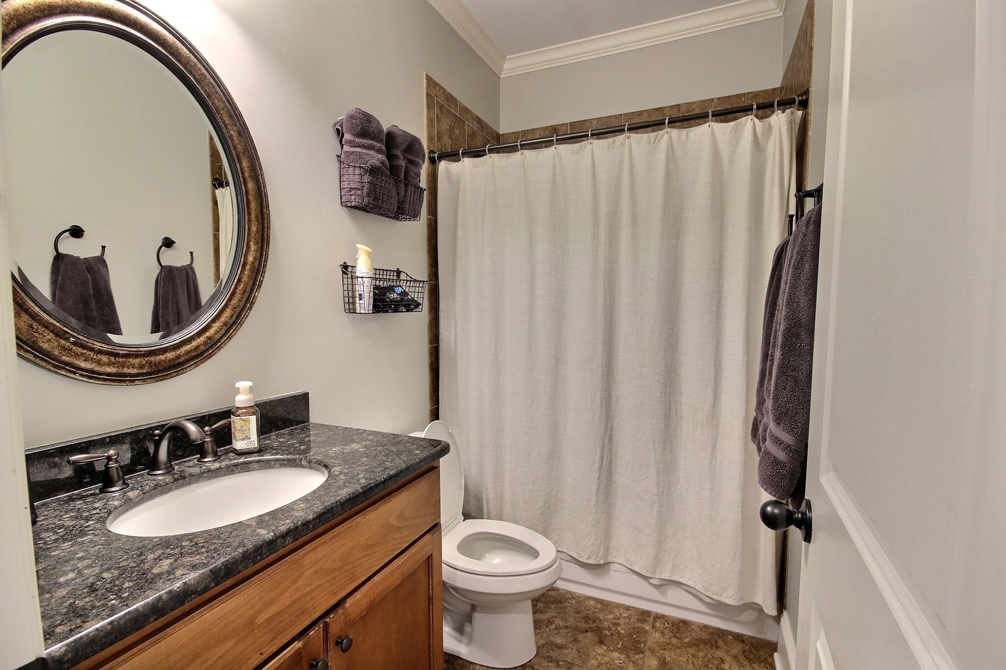 1707 Totty Lane Collierville, TN 38017 - Photo 18 of 40 a bathroom with a sink and a mirror