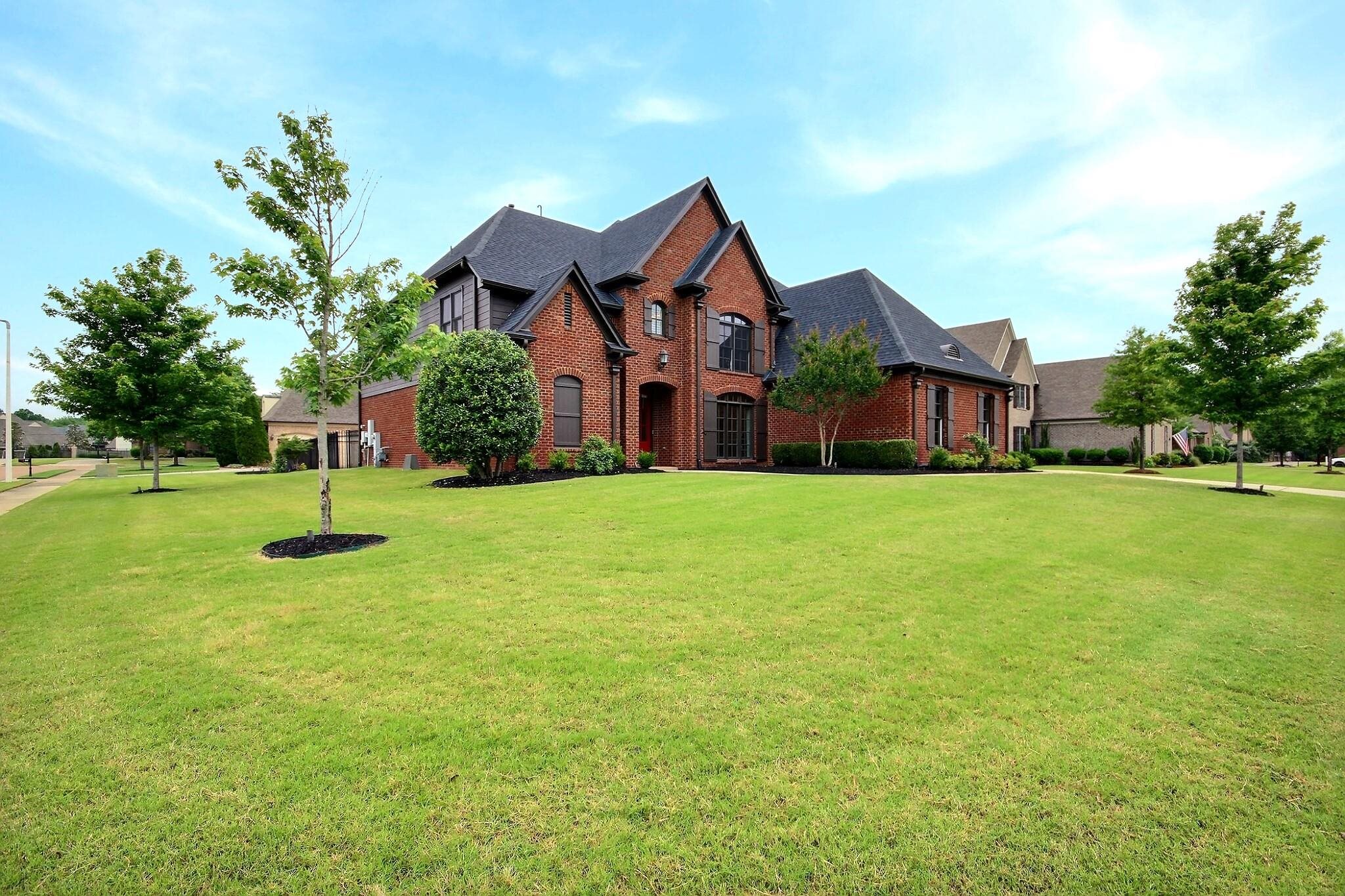 1707 Totty Lane Collierville, TN 38017 - Photo 2 of 40 a view of a house with a yard and large trees