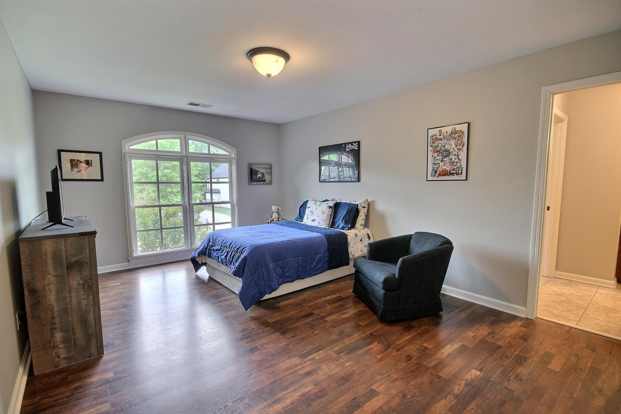 1707 Totty Lane Collierville, TN 38017 - Photo 21 of 40 a bedroom with a bed and a large window