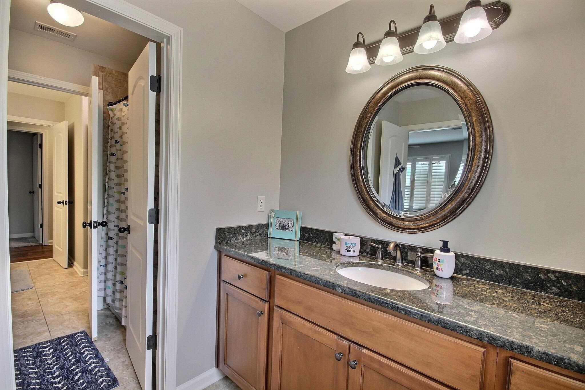 1707 Totty Lane Collierville, TN 38017 - Photo 23 of 40 a bathroom with a granite countertop double vanity sink and a mirror