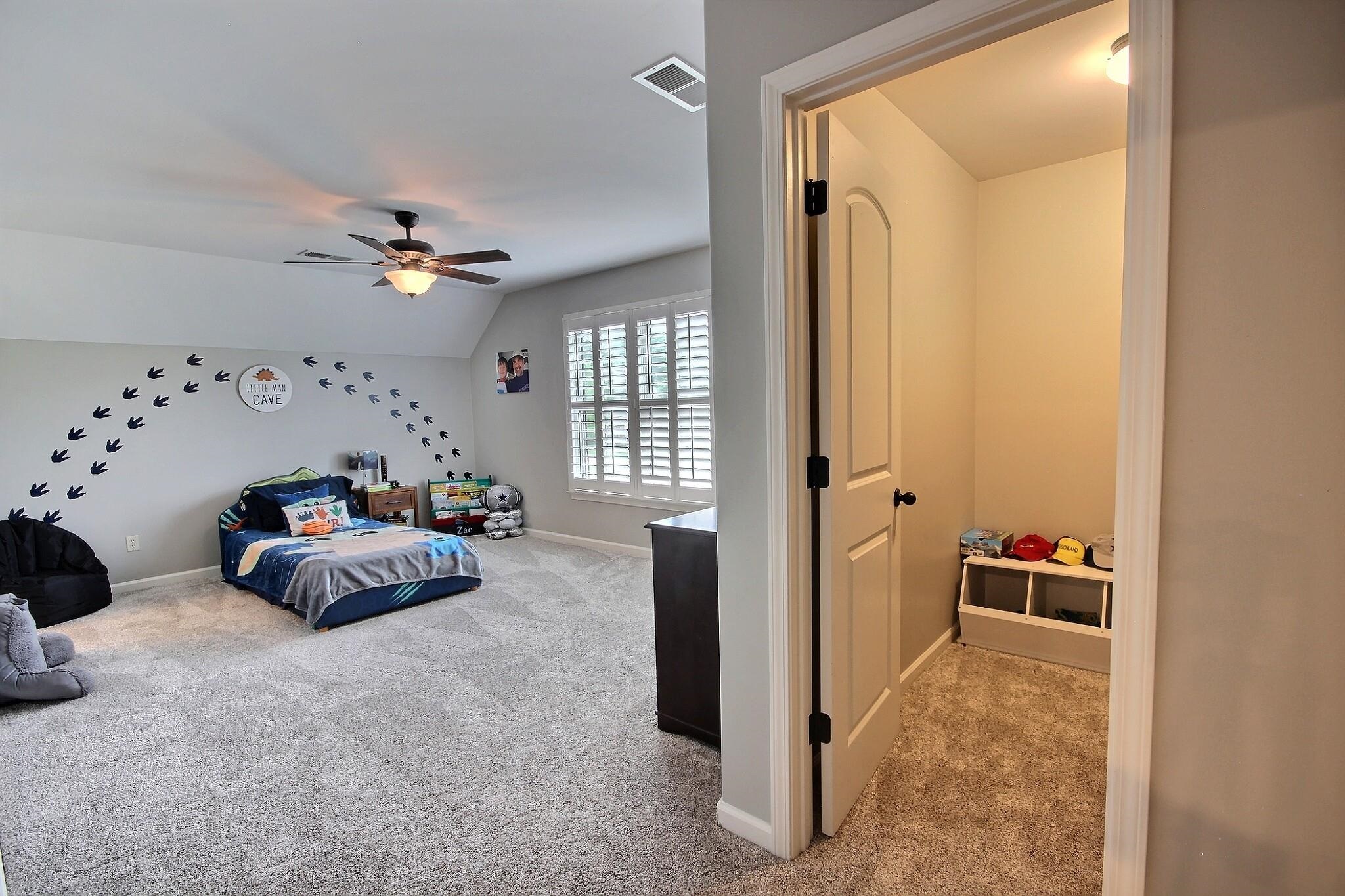 1707 Totty Lane Collierville, TN 38017 - Photo 24 of 40 a bedroom with furniture and a chandelier