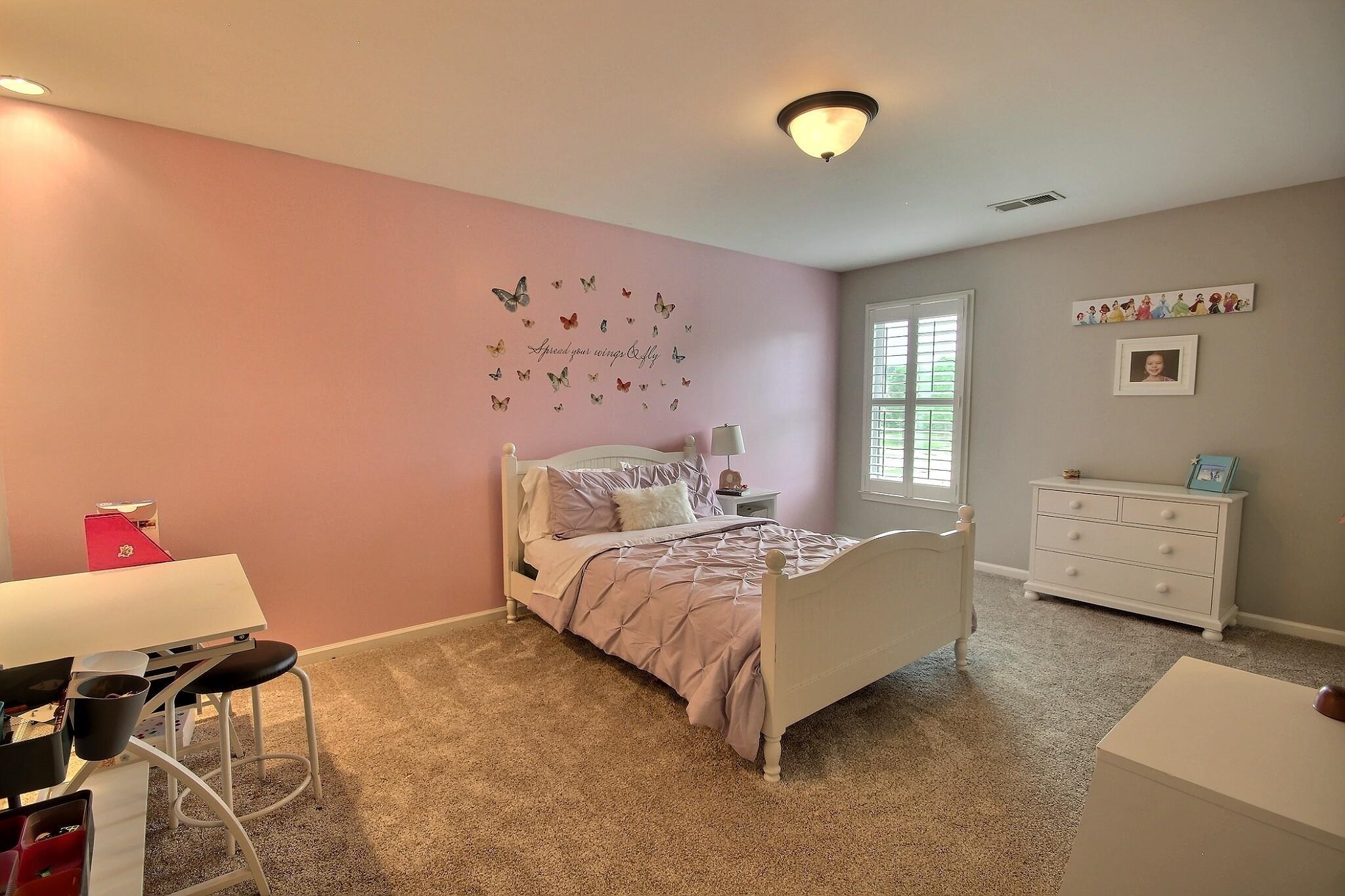 1707 Totty Lane Collierville, TN 38017 - Photo 25 of 40 a bed room with a bed and a baby crib
