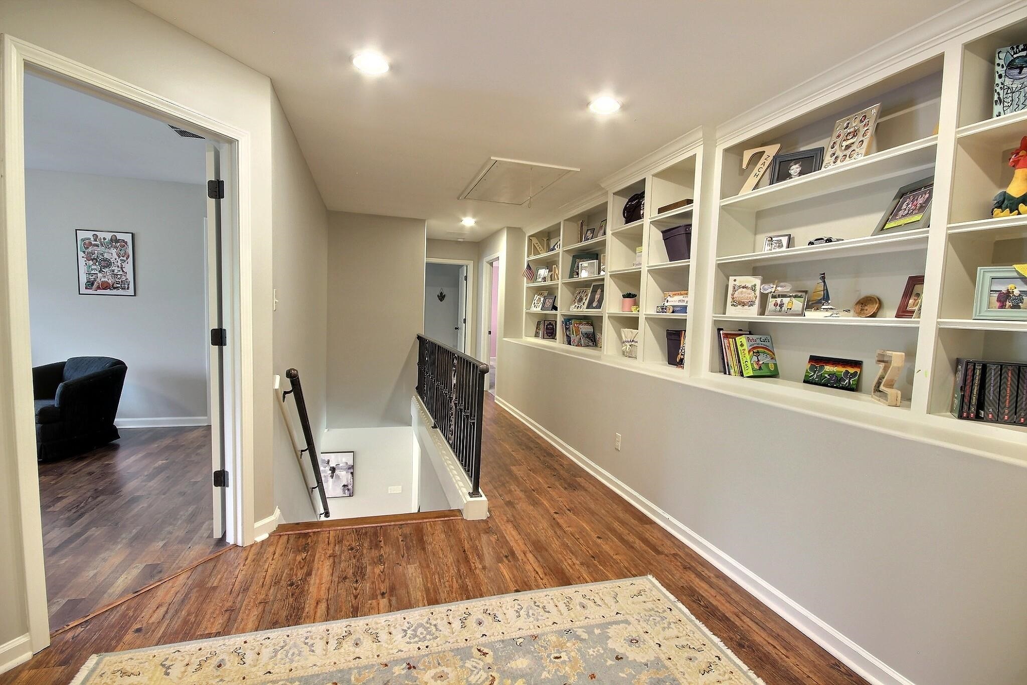1707 Totty Lane Collierville, TN 38017 - Photo 29 of 40 a view of a hallway with wooden floor and furniture