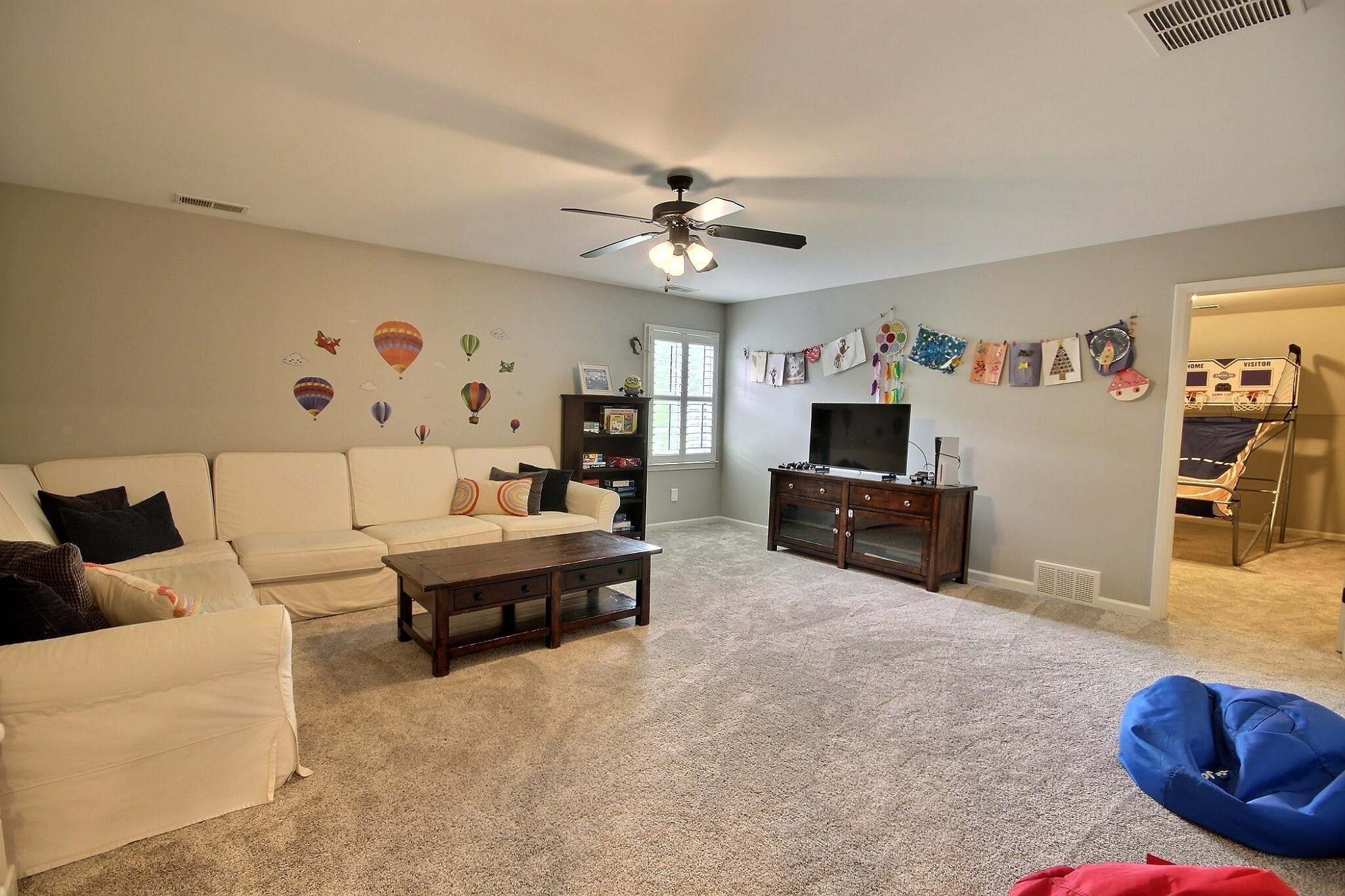 1707 Totty Lane Collierville, TN 38017 - Photo 30 of 40 a living room with furniture and a flat screen tv