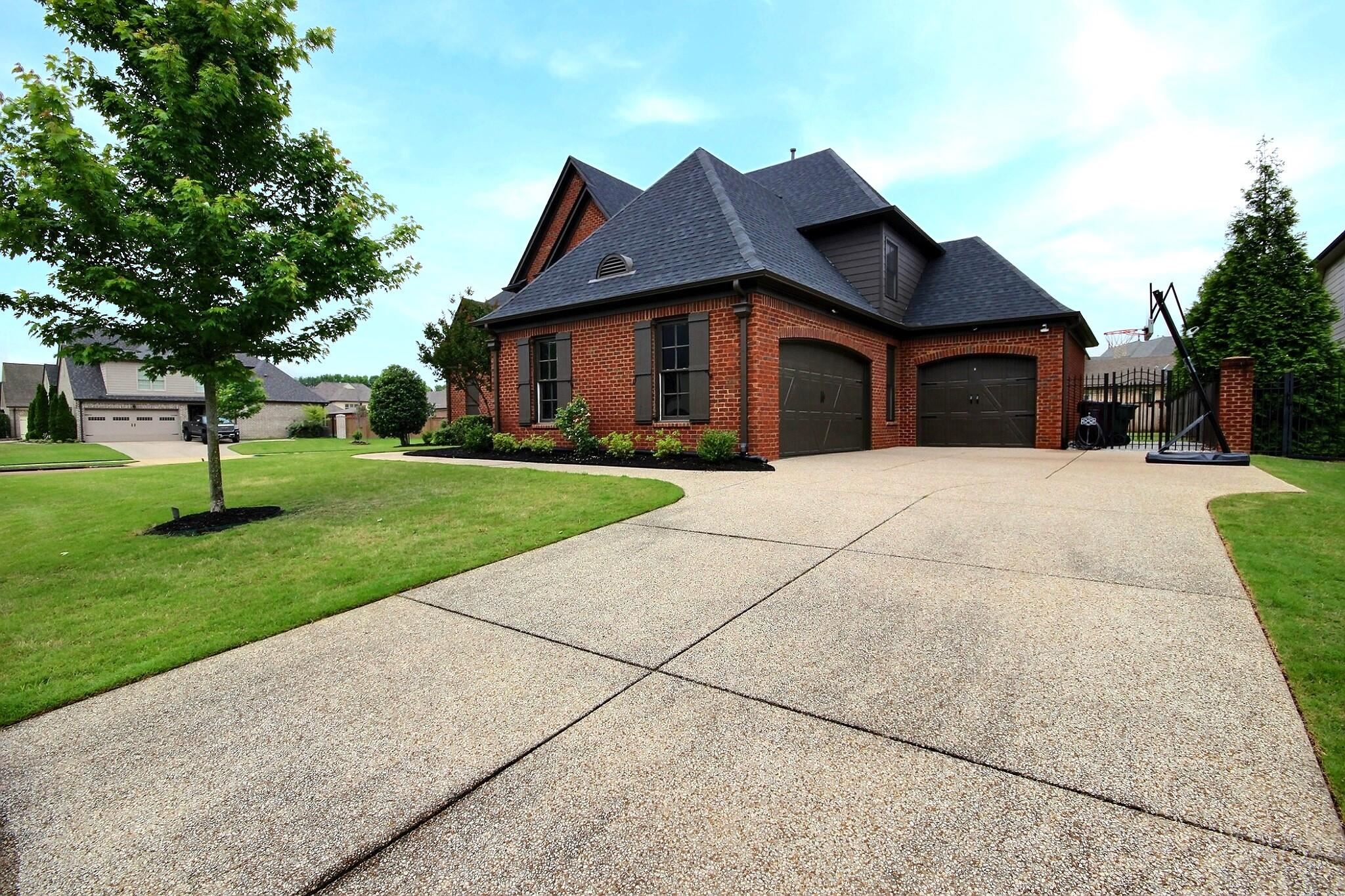 1707 Totty Lane Collierville, TN 38017 - Photo 3 of 40 a front view of house with yard and green space
