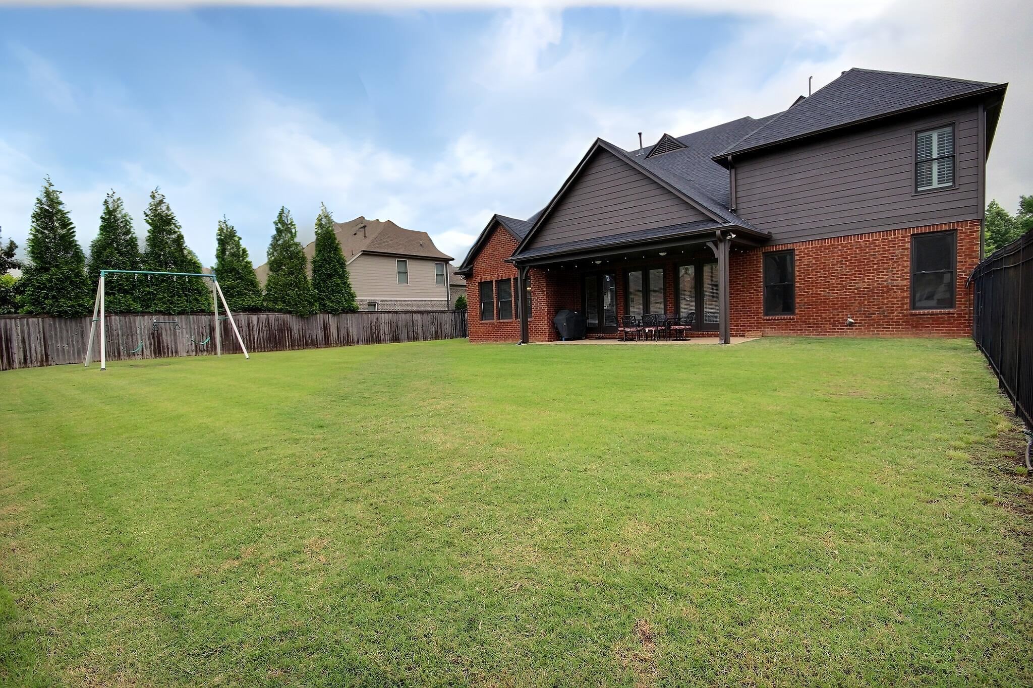 1707 Totty Lane Collierville, TN 38017 - Photo 35 of 40 a house that has a big yard with wooden fence