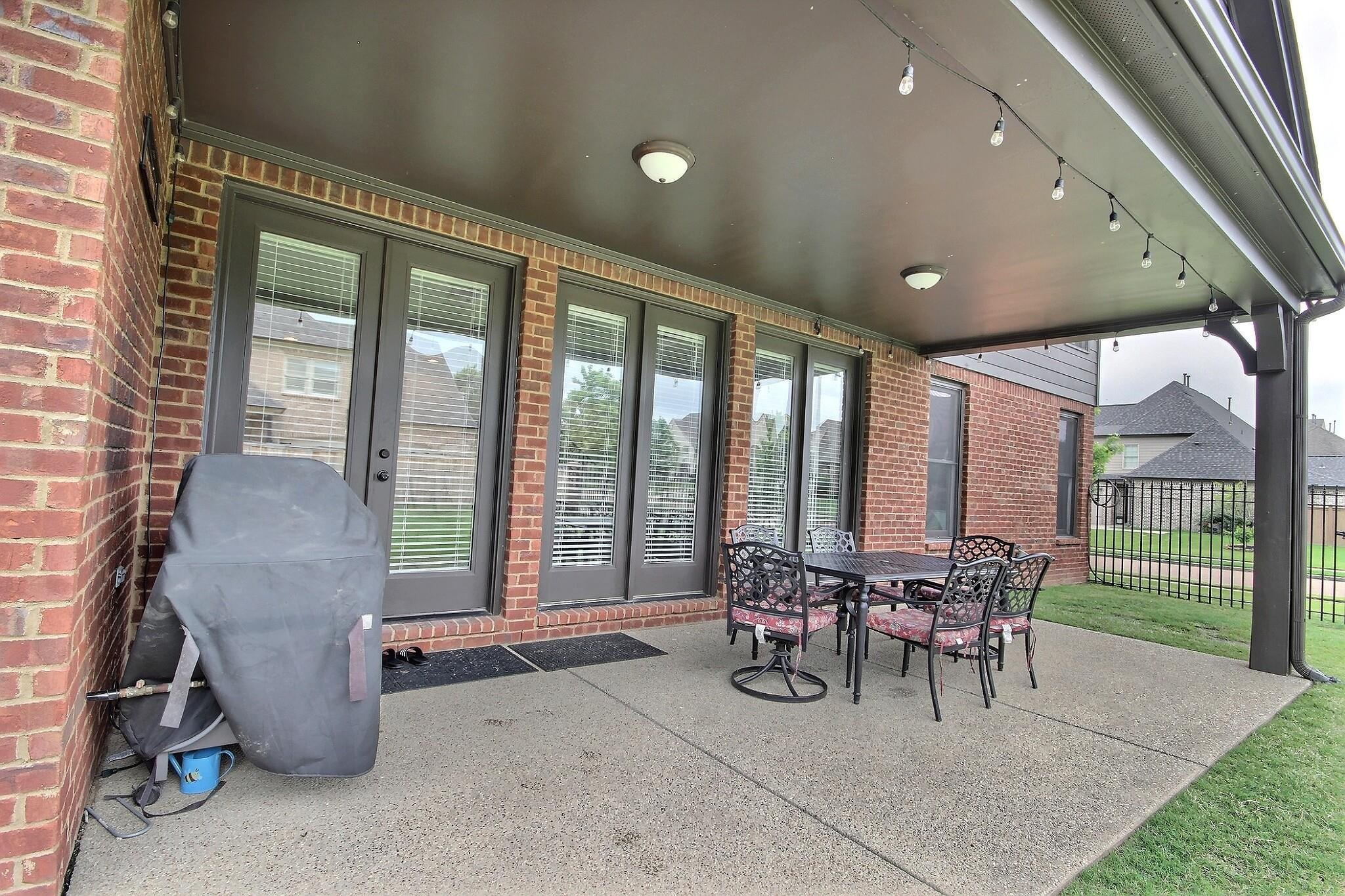 1707 Totty Lane Collierville, TN 38017 - Photo 36 of 40 a living room with furniture and a floor to ceiling window