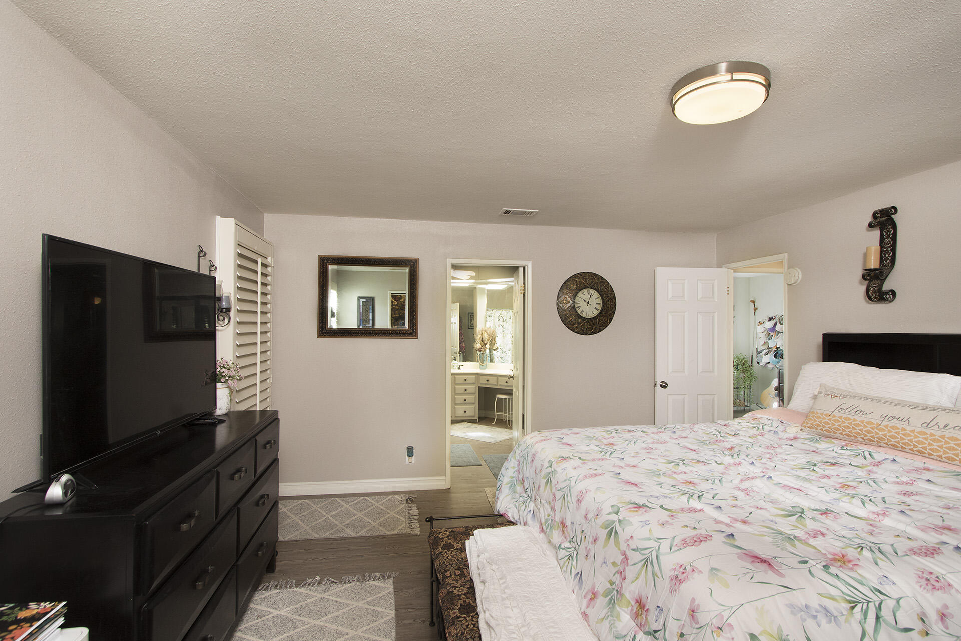34649 Double Diamond Drive Thousand Palms, CA 92276 - Photo 11 of 42 a bedroom with a bed and a flat screen tv