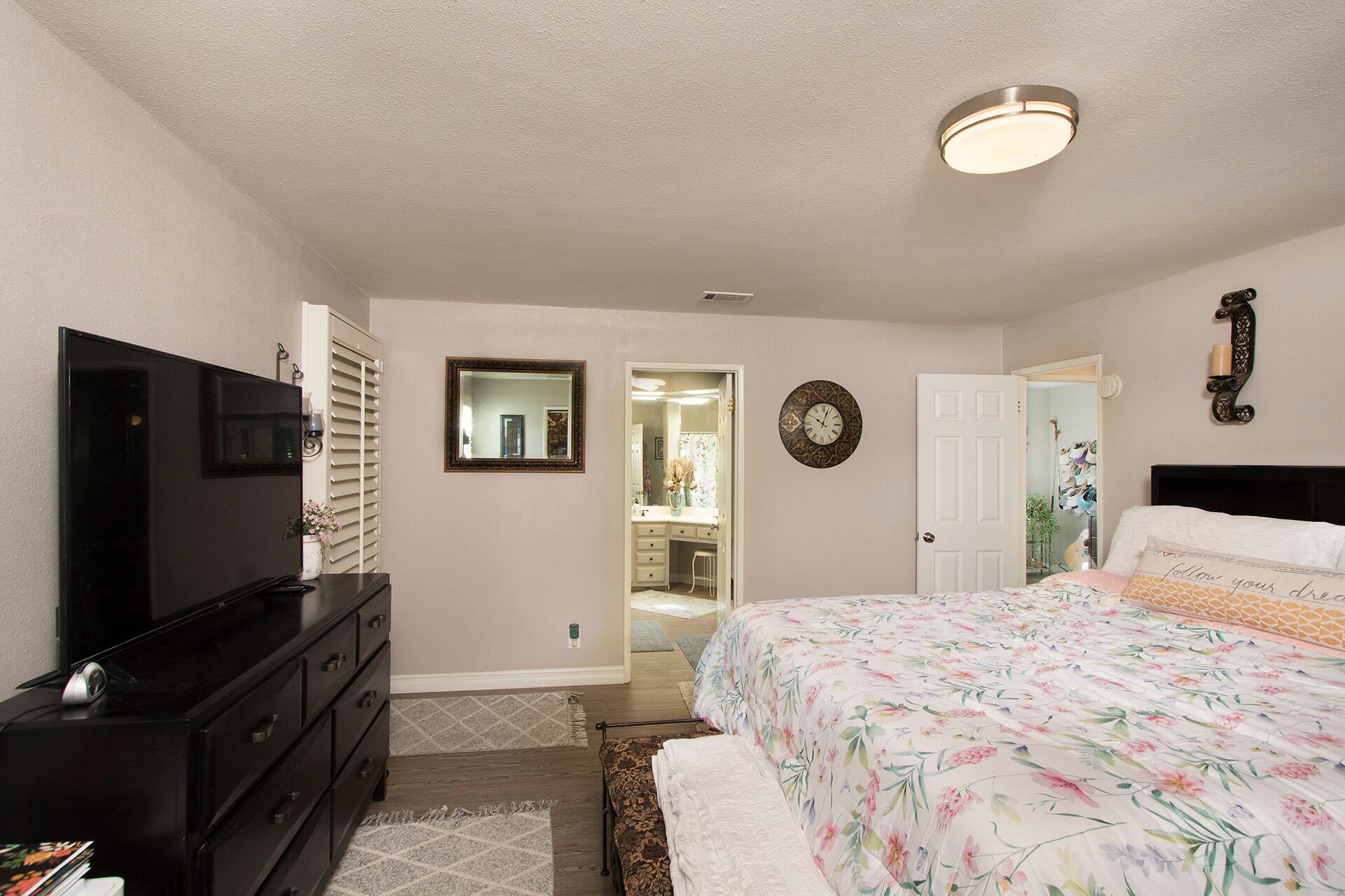 34649 Double Diamond Drive Thousand Palms, CA 92276 - Photo 12 of 42 a bedroom with a bed and a flat screen tv