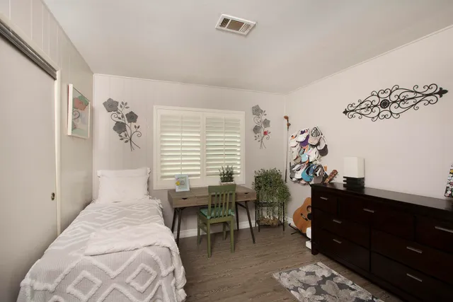 a bed room with a bed and a couch