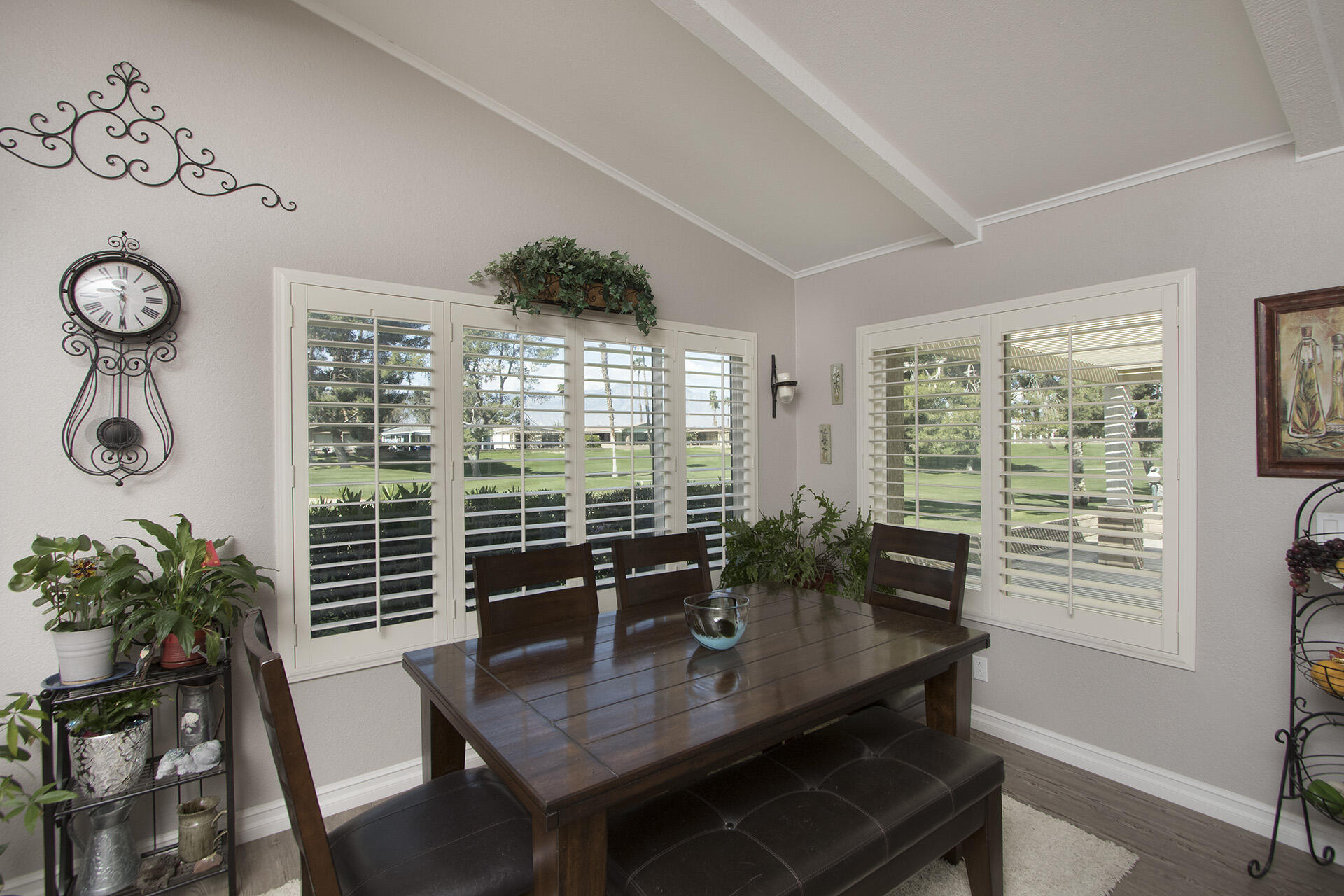 34649 Double Diamond Drive Thousand Palms, CA 92276 - Photo 19 of 42 a view of a dining room with furniture window and wooden floor