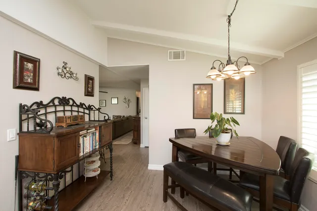 a large kitchen with stainless steel appliances granite countertop a sink stove and cabinets