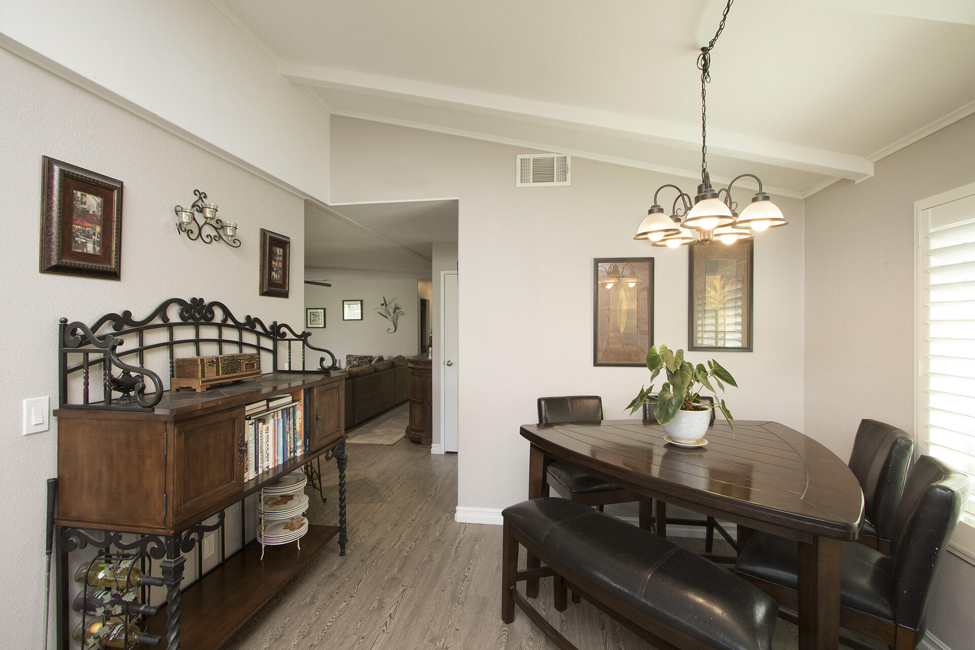 34649 Double Diamond Drive Thousand Palms, CA 92276 - Photo 24 of 42 a view of a dining room with furniture and a chandelier