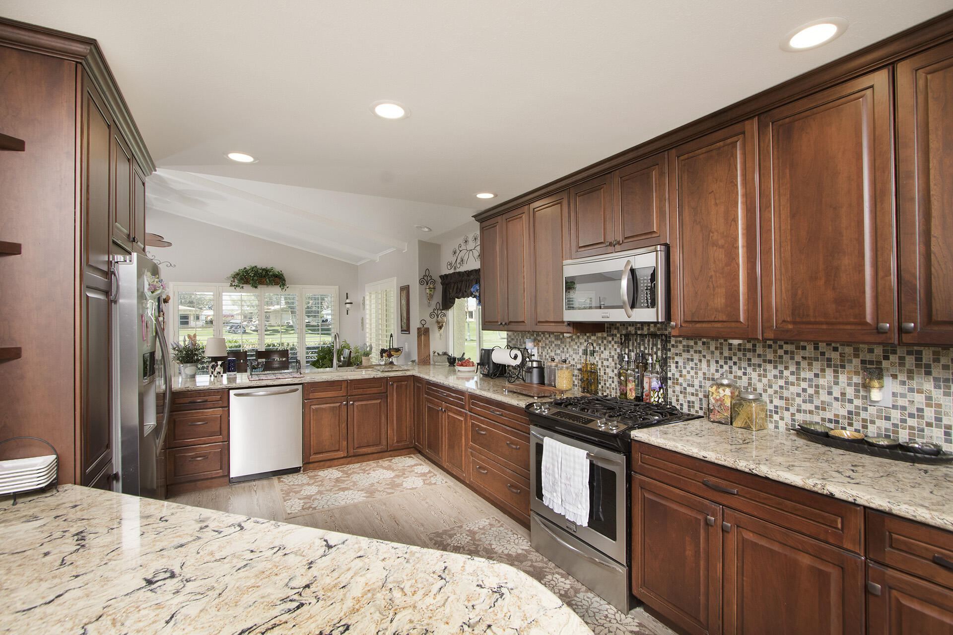 34649 Double Diamond Drive Thousand Palms, CA 92276 - Photo 27 of 42 a kitchen with a sink stove and refrigerator